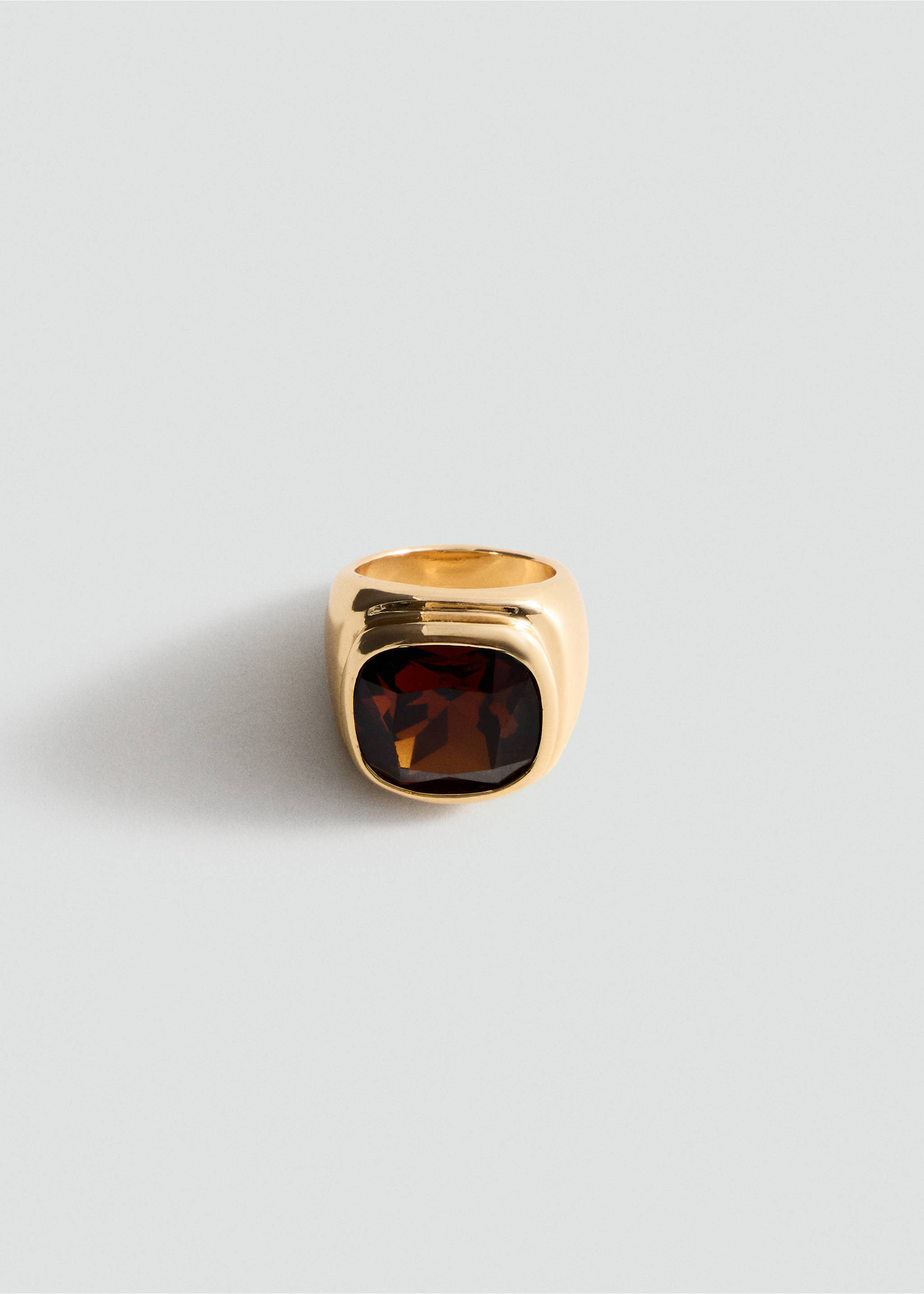 Gold-finish ring with a thick band and a square bezel-set faceted brown stone., Gold. Ref: 47071386-00.