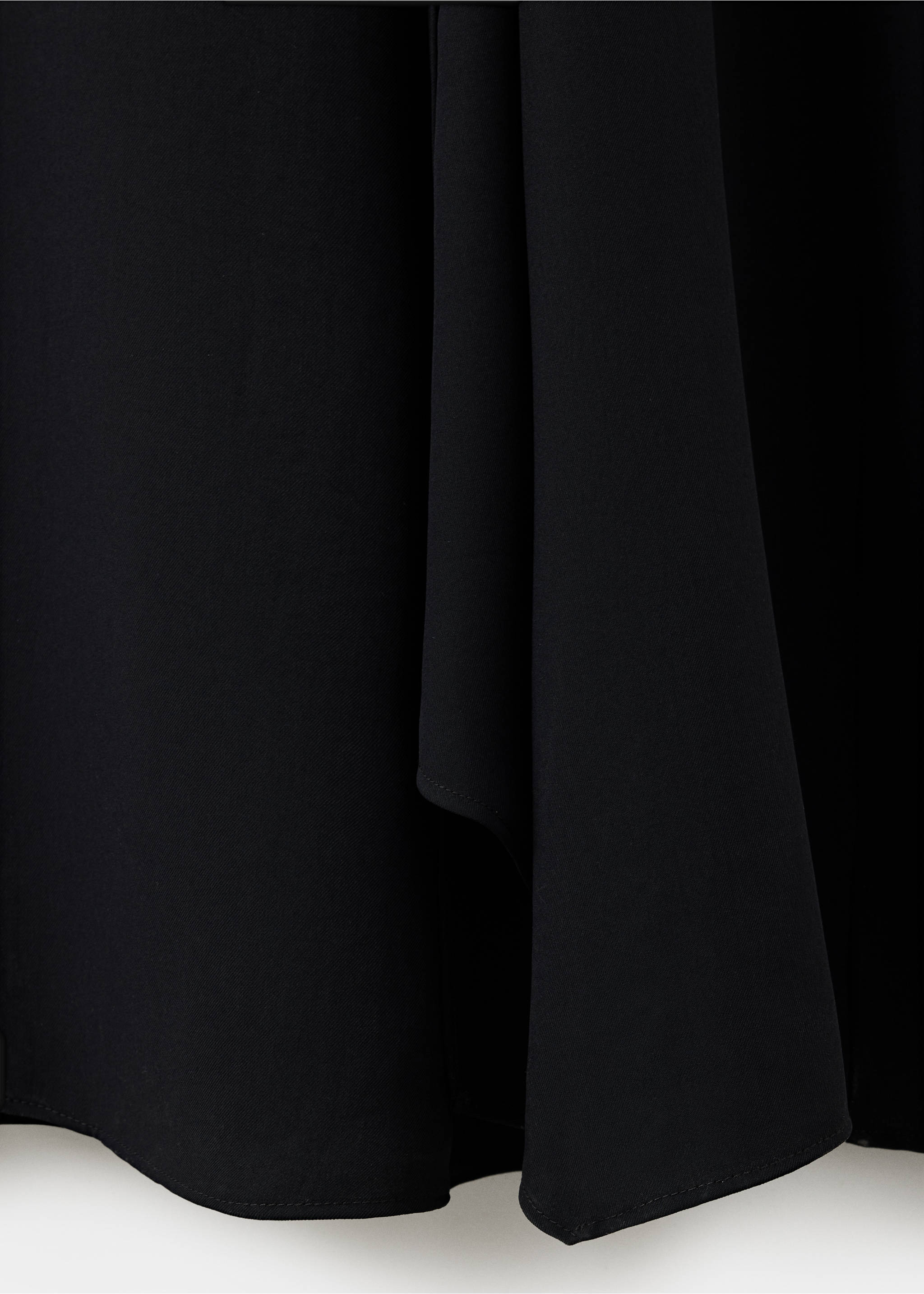 Close-up of the black dress fabric texture and drape., Black. Ref: 47071425-00.