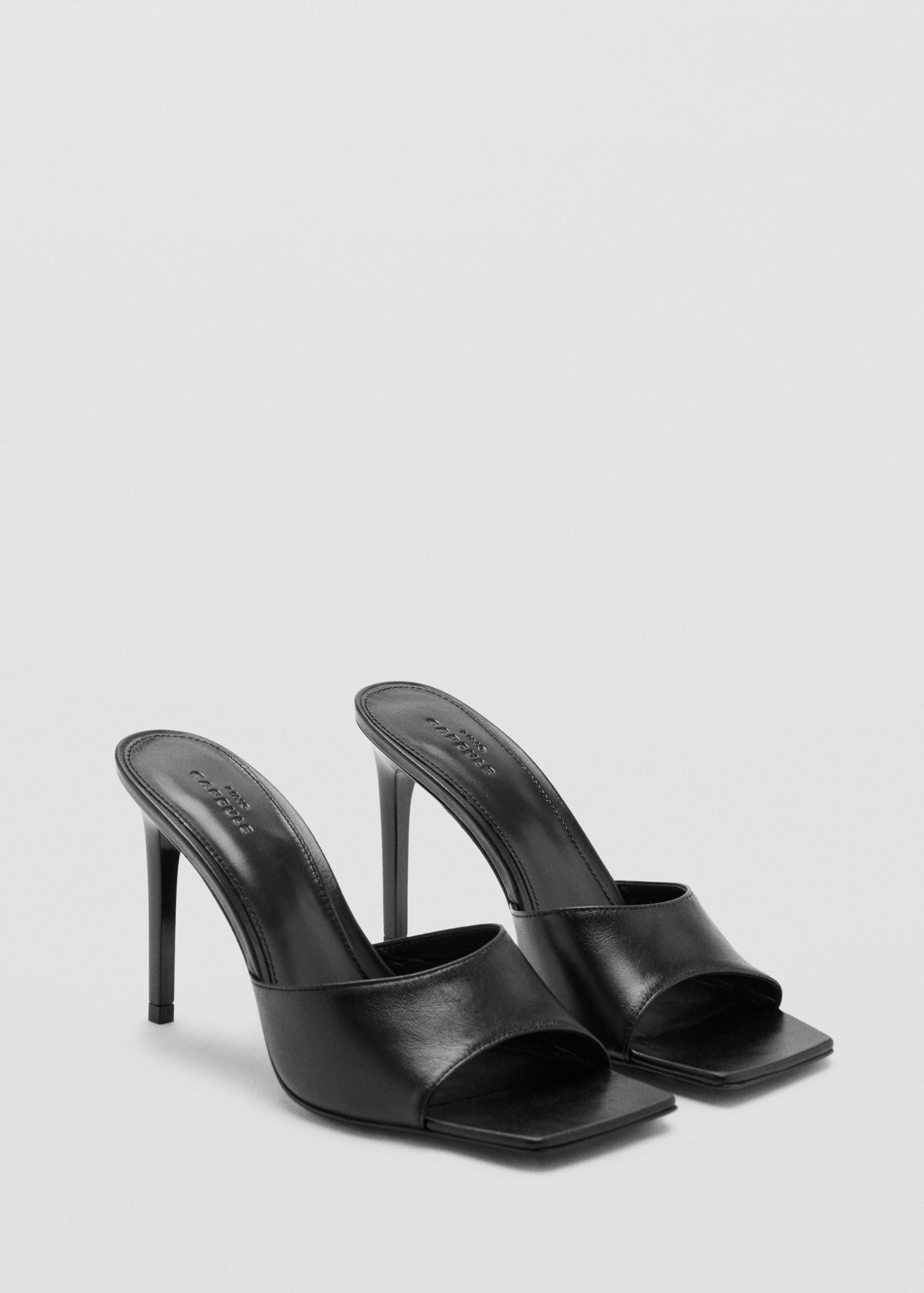 Black high-heeled sandals with a square open toe and stiletto heel.