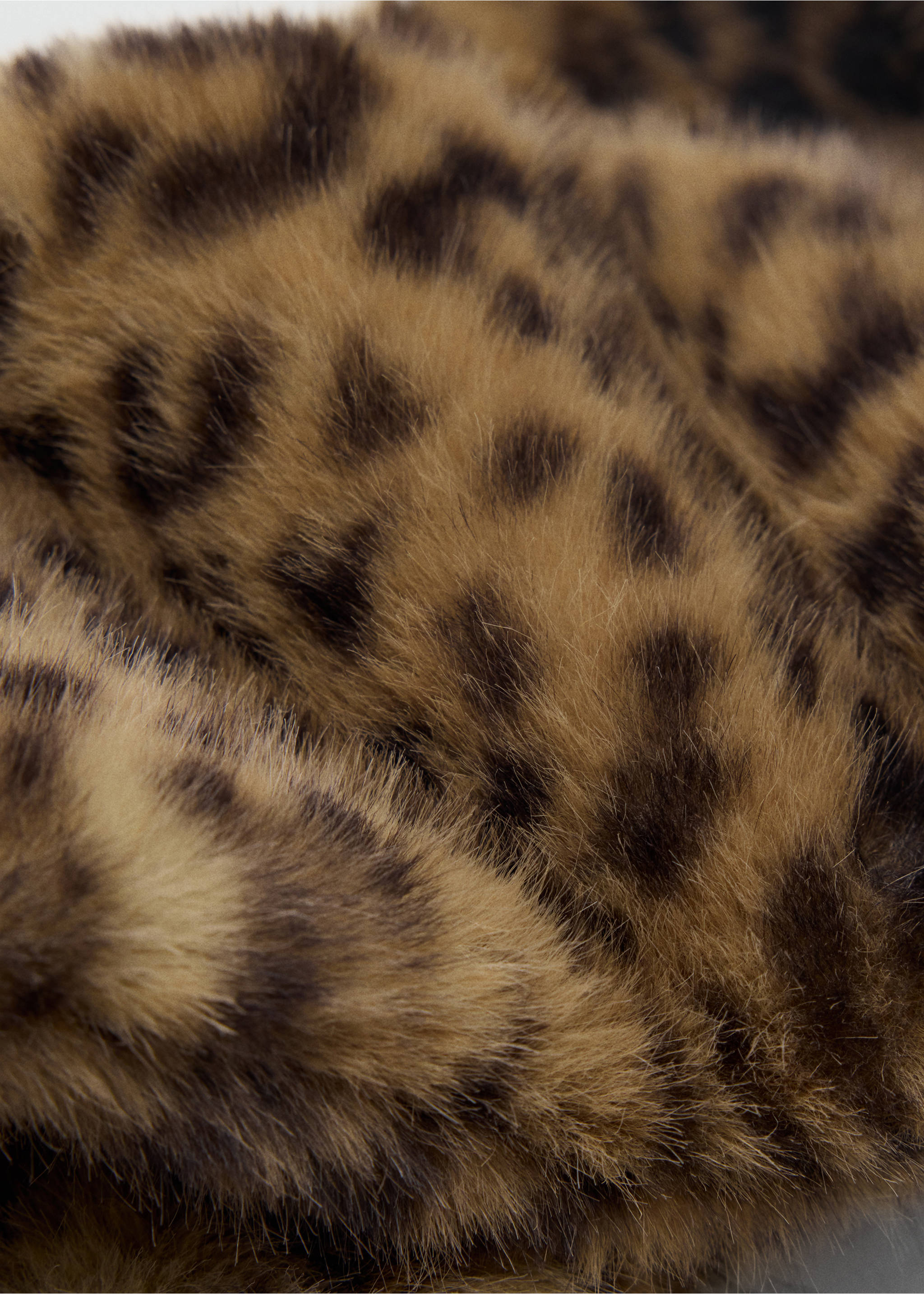 Leopard print faux-fur scarf in a close-up detail view., Brown. Ref: 47081357-00.