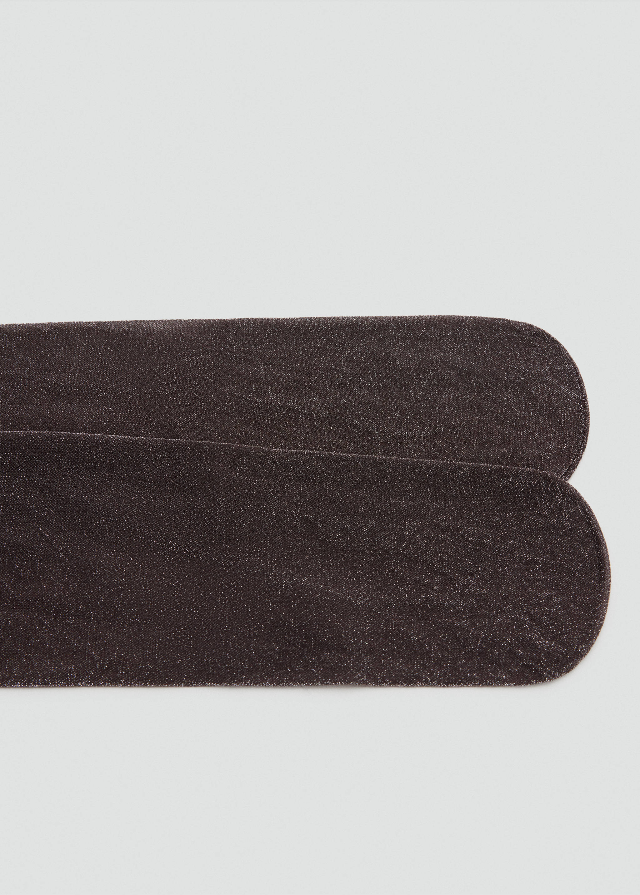 Close-up of shimmering dark brown tights toe section., Chocolate. Ref: 47081374-00.