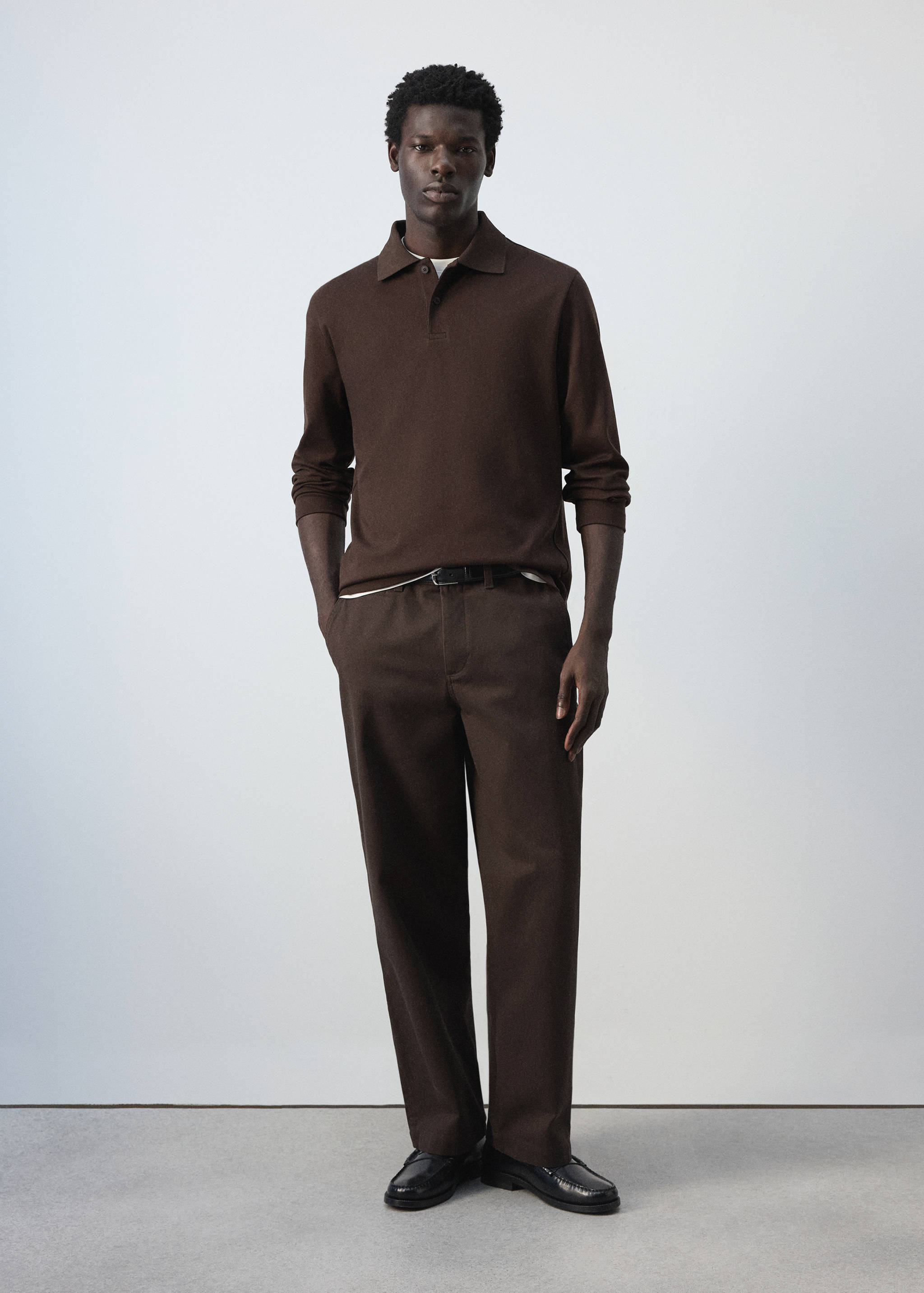Brown long-sleeved polo shirt with a classic collar and button placket.