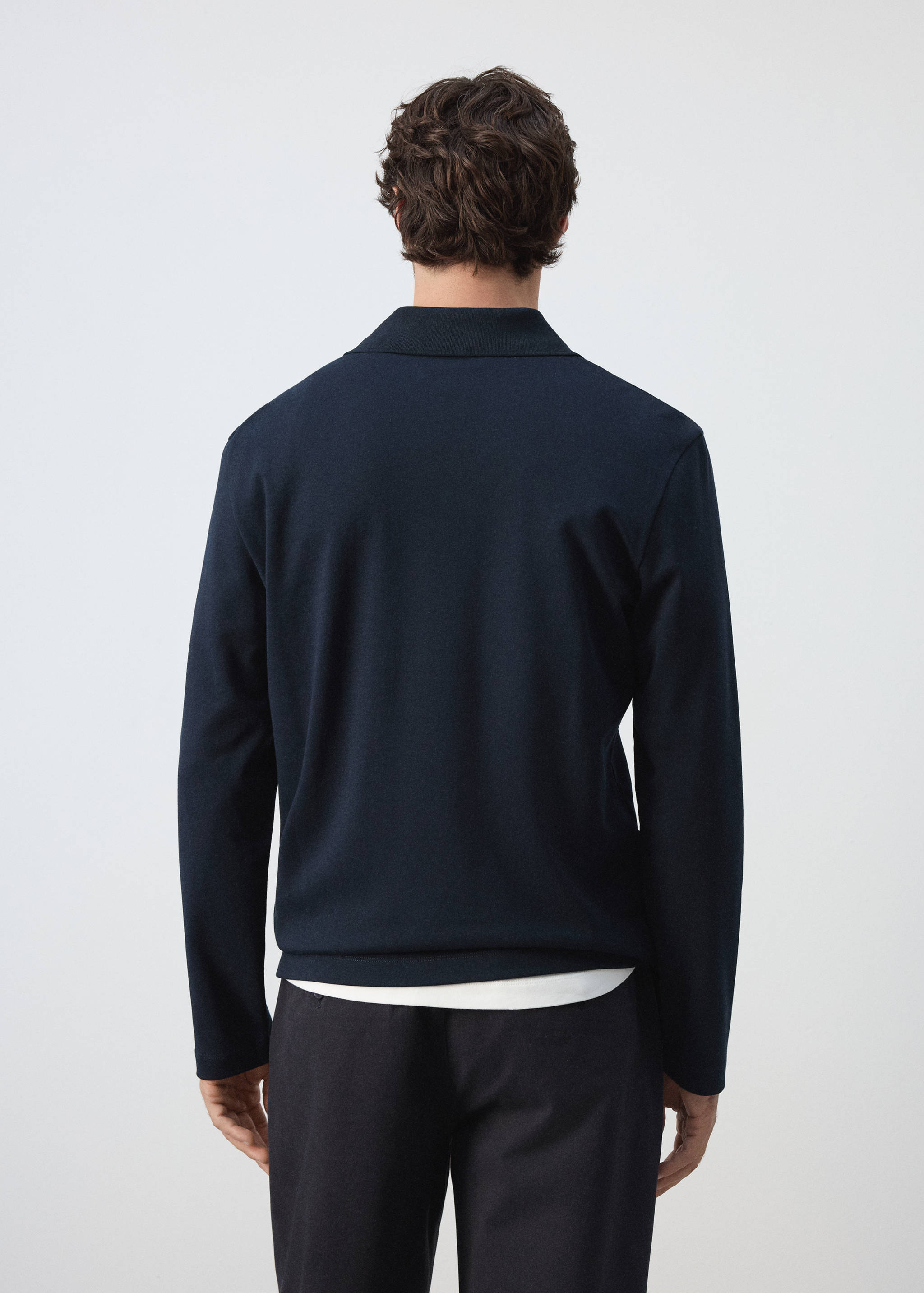 Back view of a dark navy blue long-sleeved polo shirt.