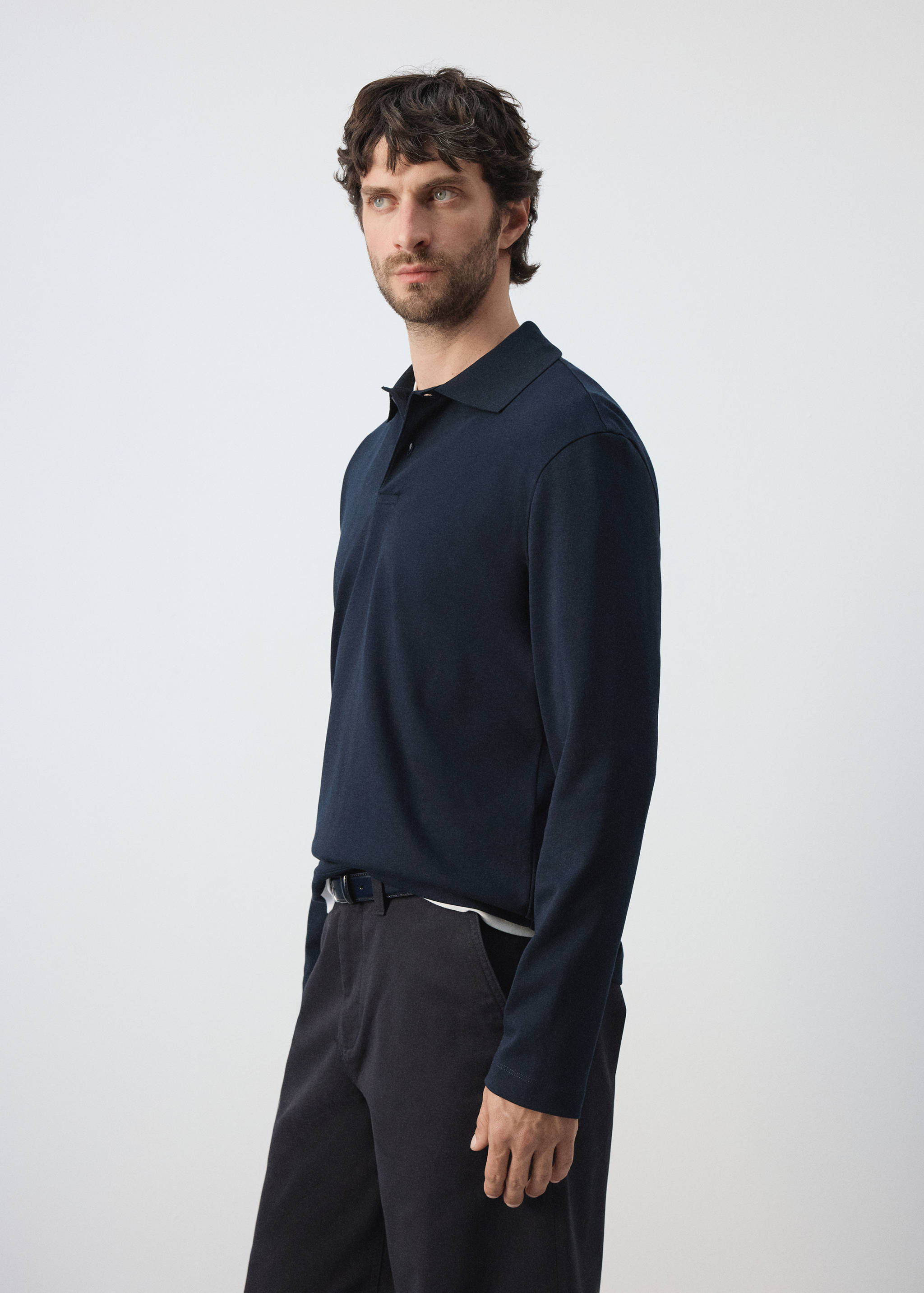 Navy blue long-sleeved polo shirt with a classic collar and button placket.