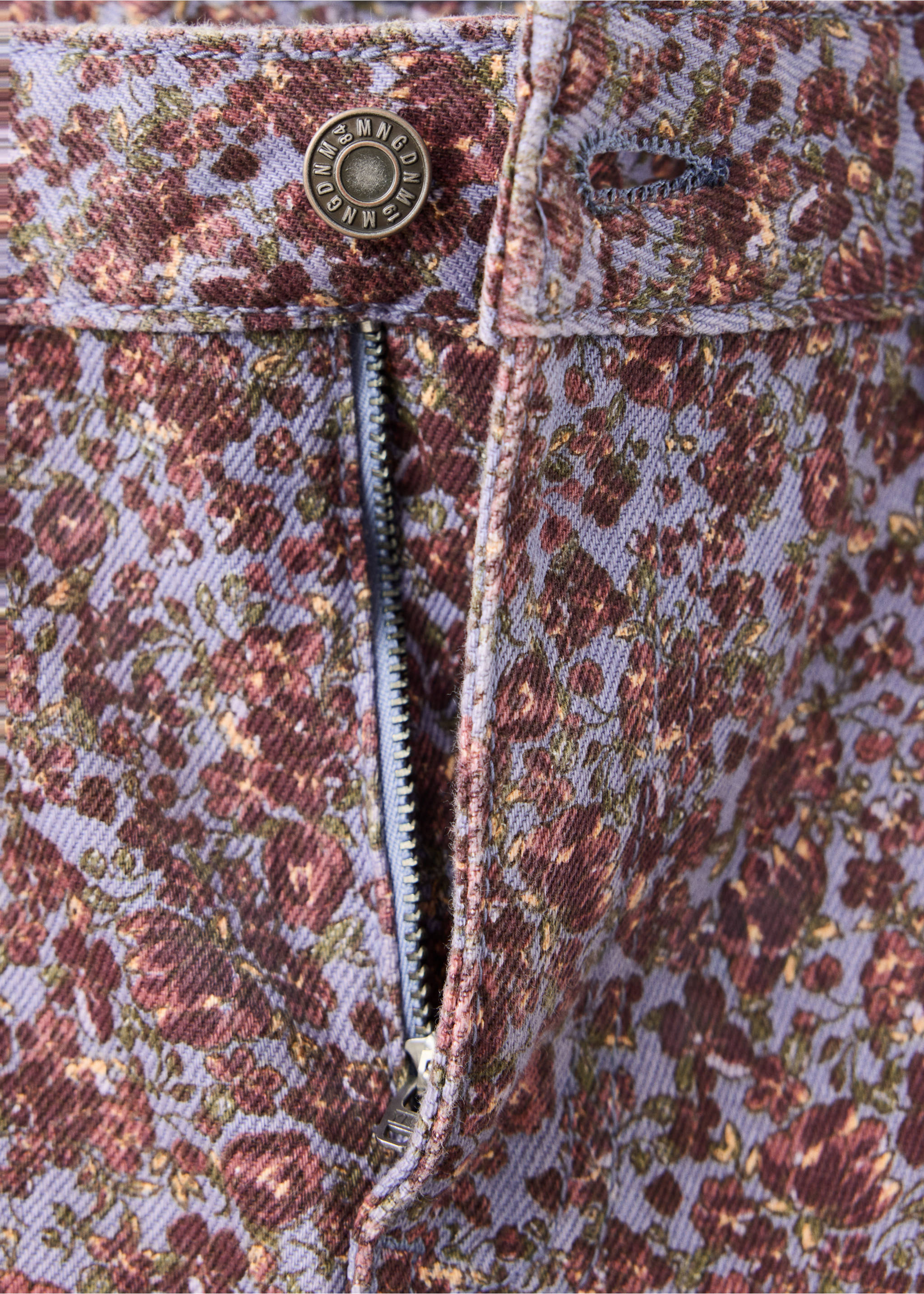 Close-up of the waistband and fly on purple floral print denim trousers., Sky Blue. Ref: 47081424-00.