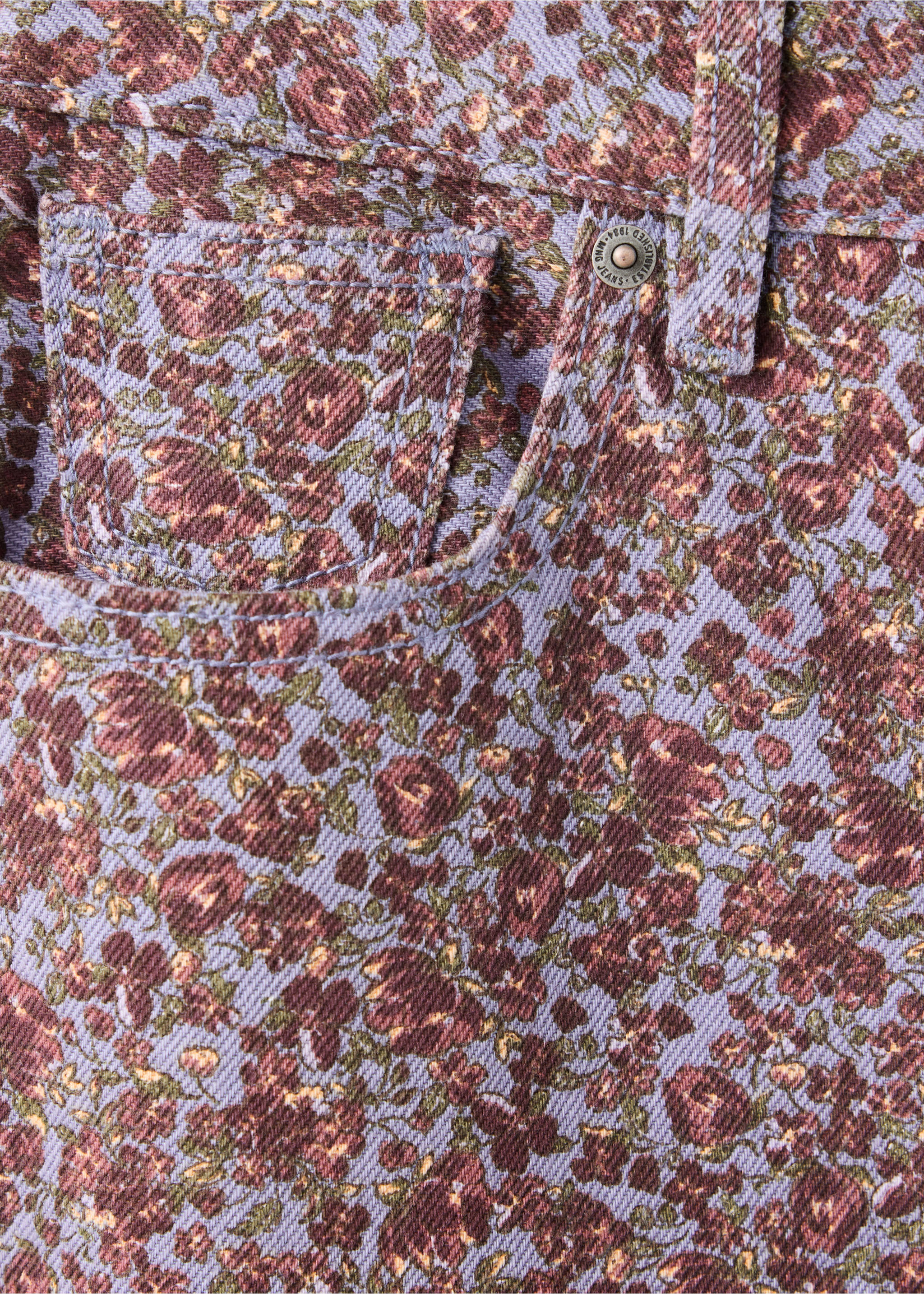 Close-up of lilac floral denim trousers showing fabric detail., Sky Blue. Ref: 47081424-00.