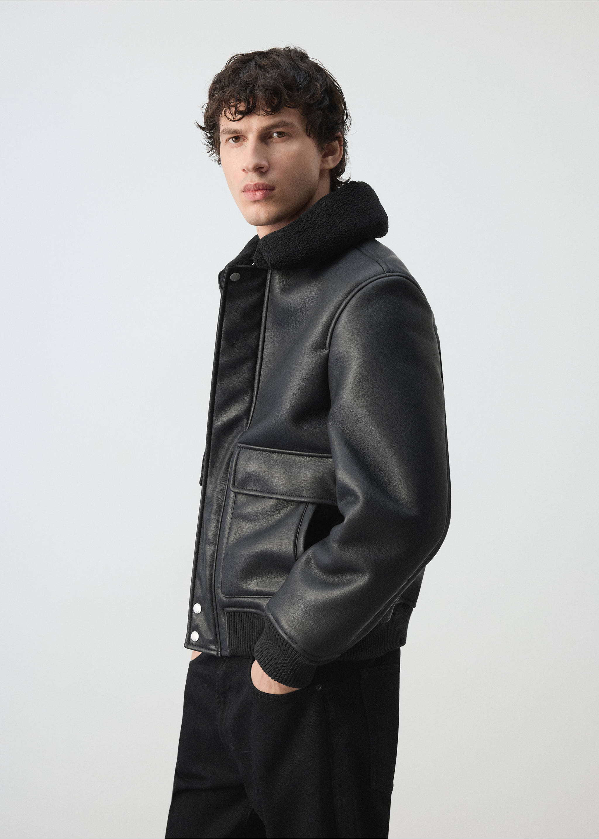 Black jacket with faux-shearling collar and front flap pockets., Black. Ref: 47091329-00.
