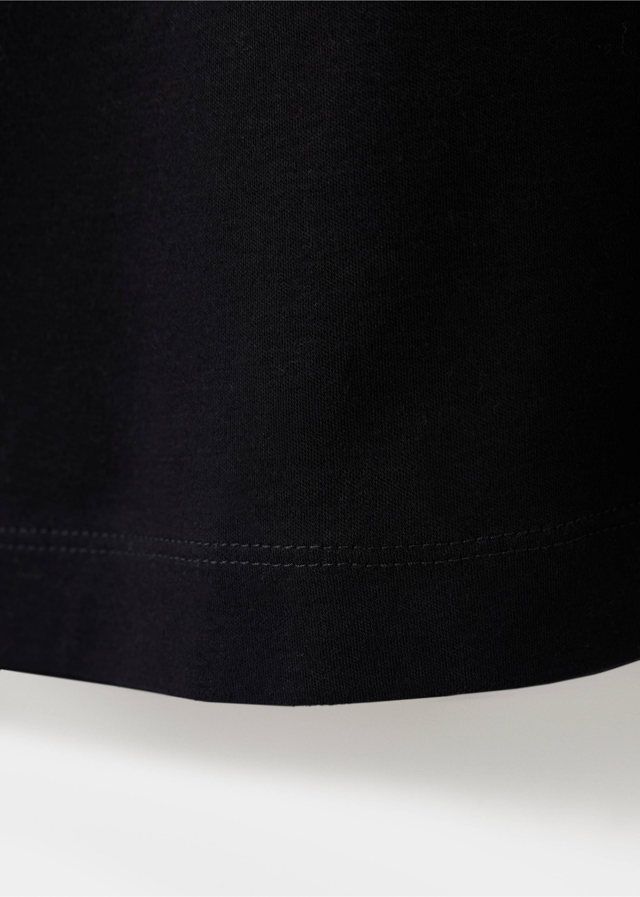Black t-shirt fabric and hem detail., Black. Ref: 47091350-00.