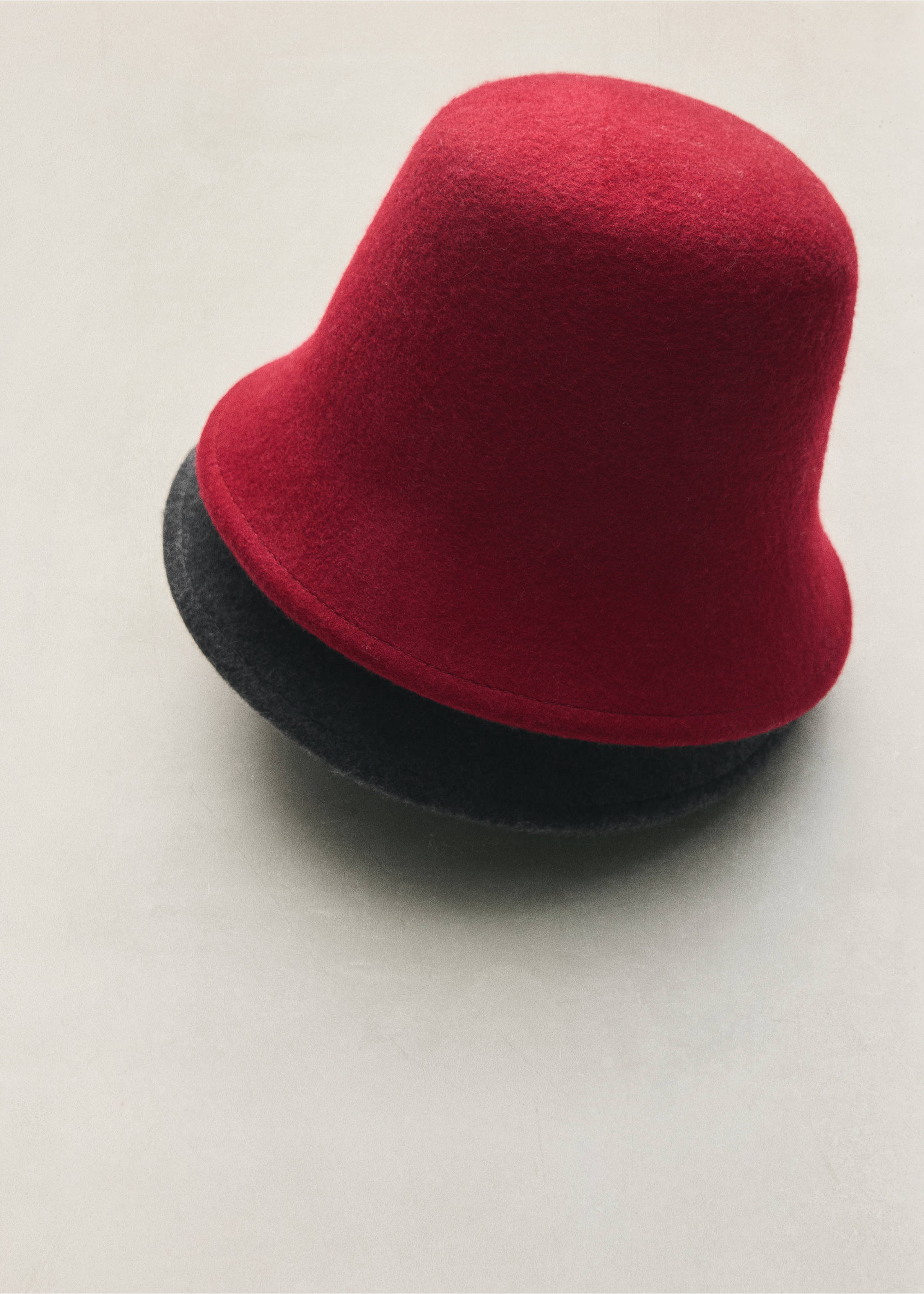 Red felt bucket hat stacked on top of a dark grey one., Red. Ref: 47091351-00.