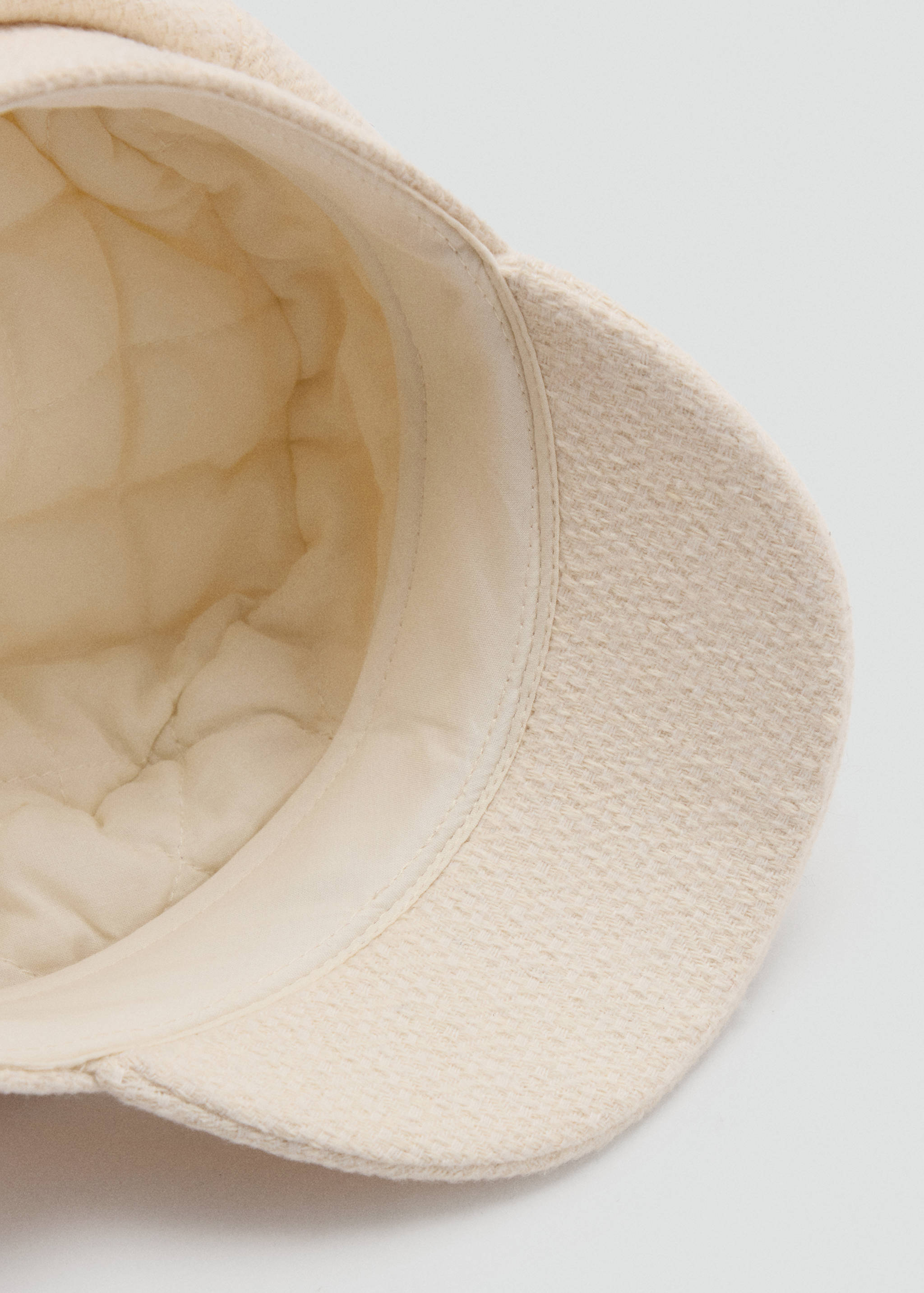 Cream sailor cap with quilted interior lining detail