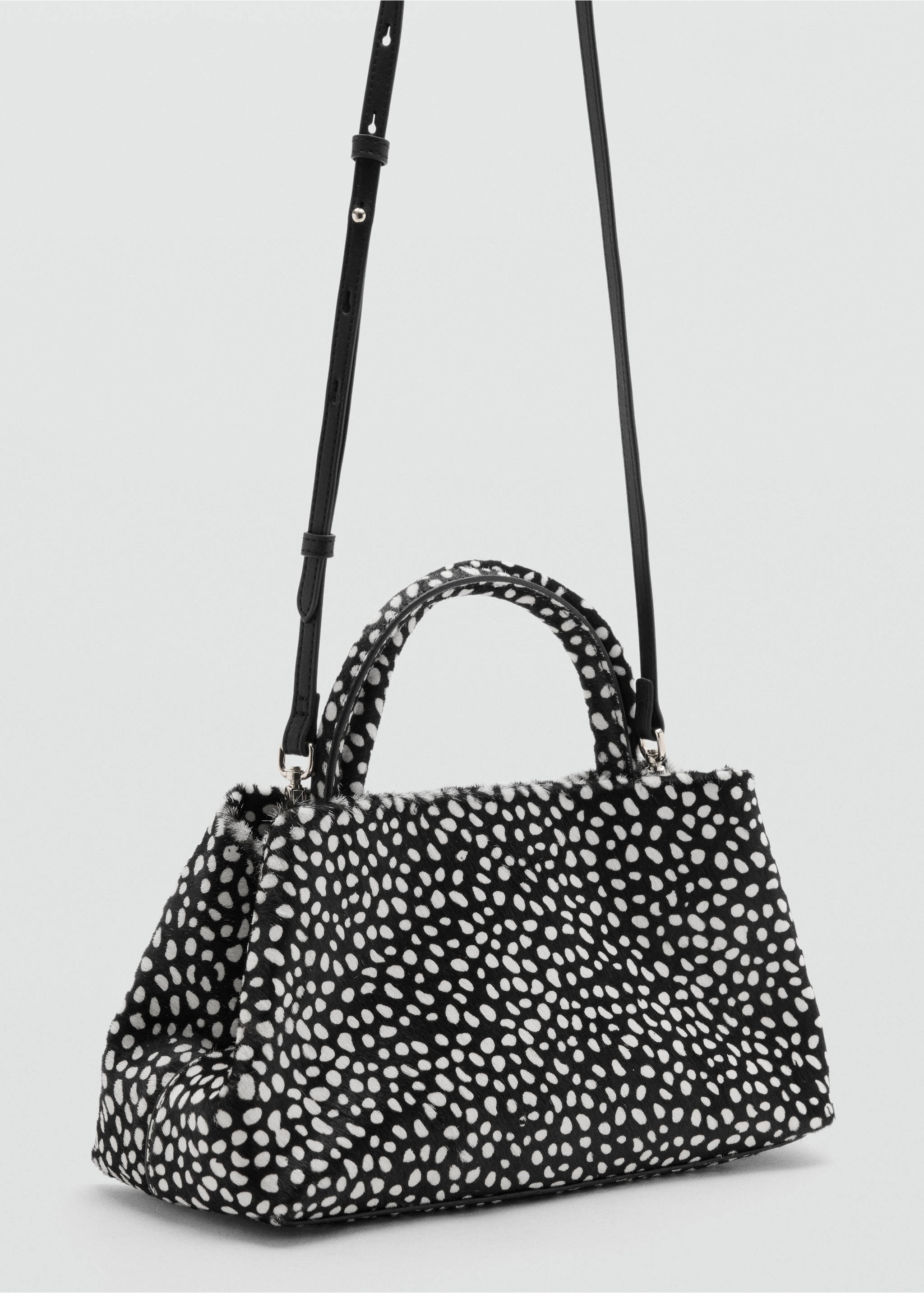 Black and white dalmatian-print faux-fur handbag with top handles and a black shoulder strap., Black. Ref: 47091375-00.