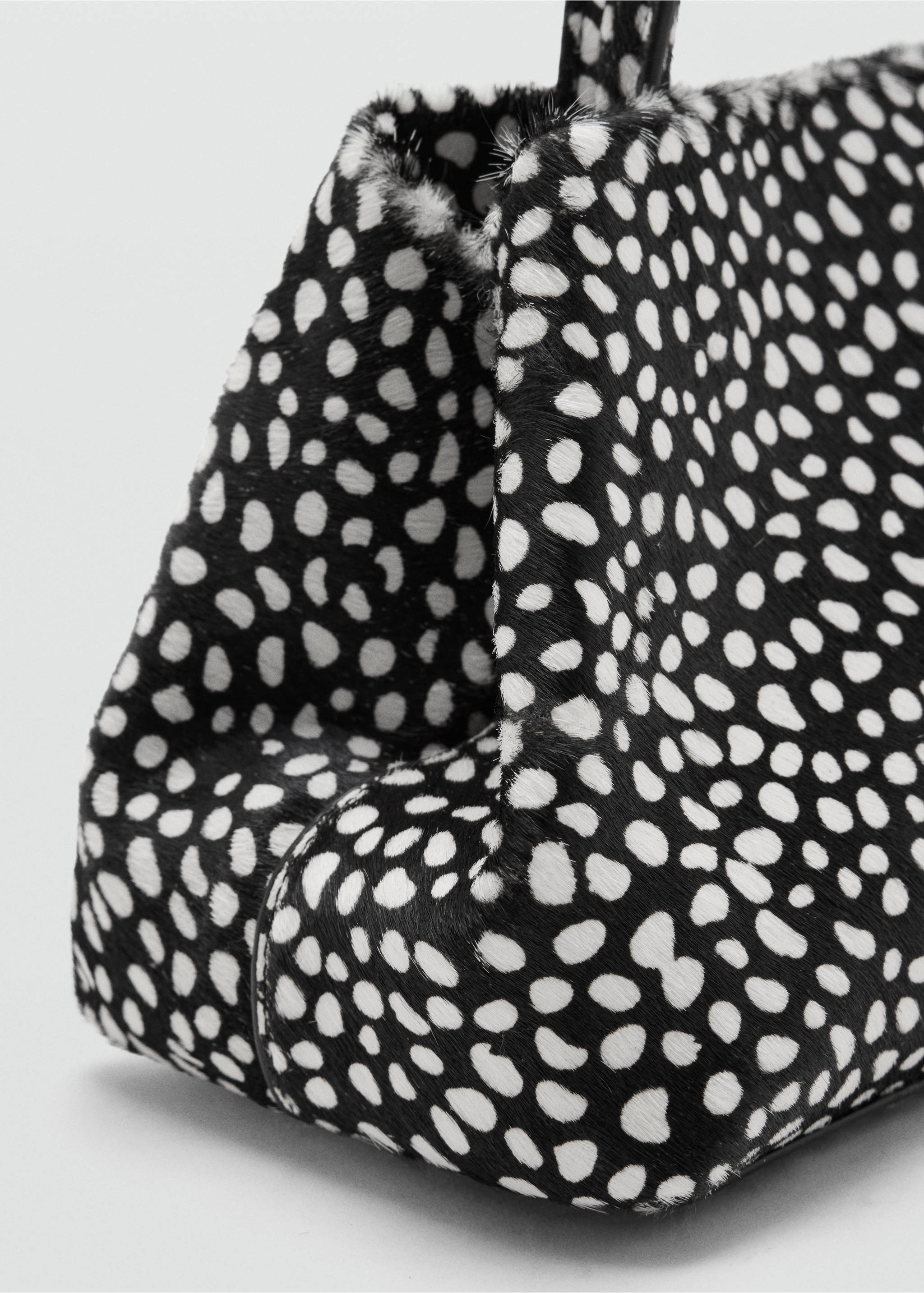 Black and white faux-fur handbag with animal print detail., Black. Ref: 47091375-00.