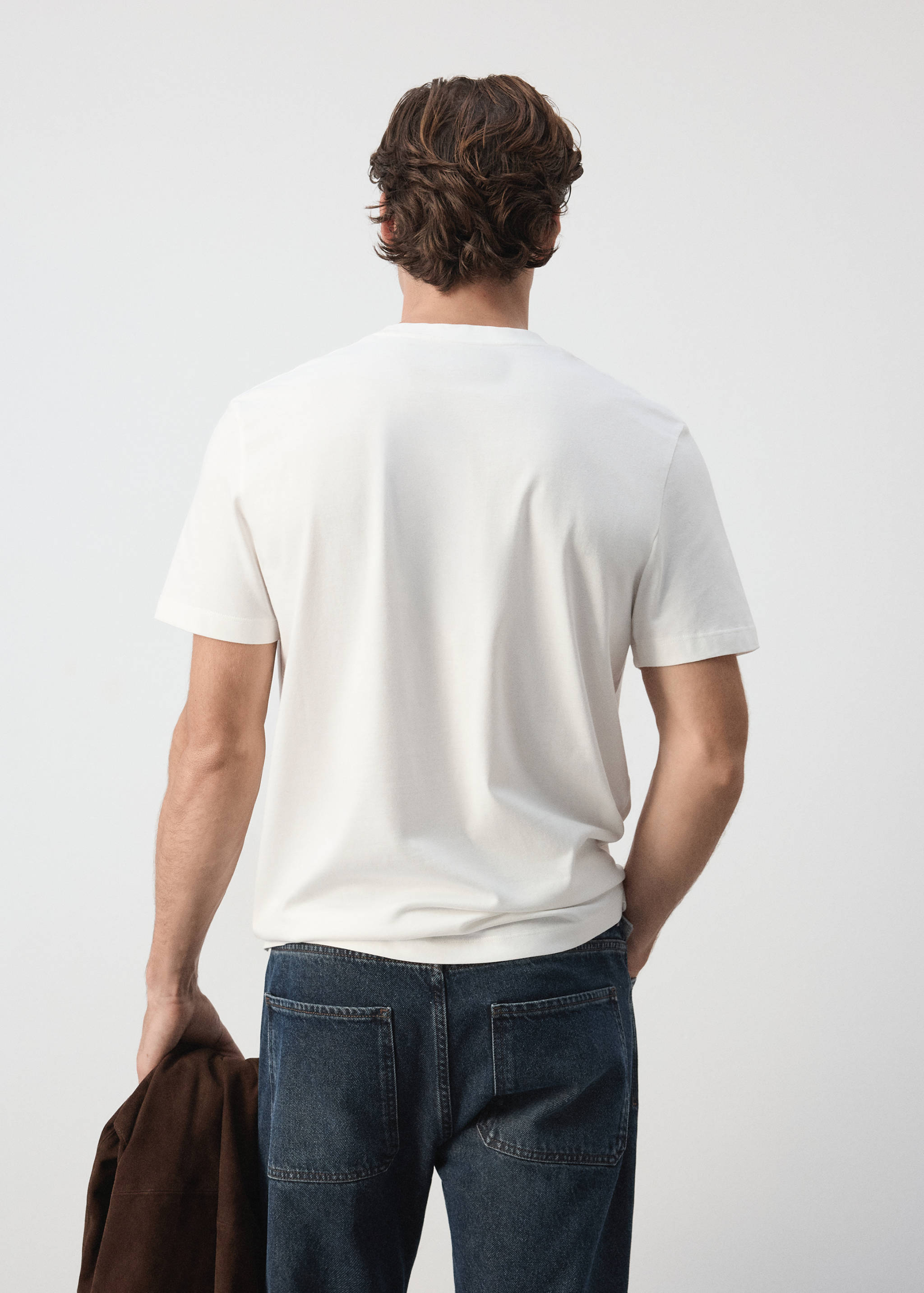 White t-shirt seen from the back, featuring short sleeves and a crew neckline.