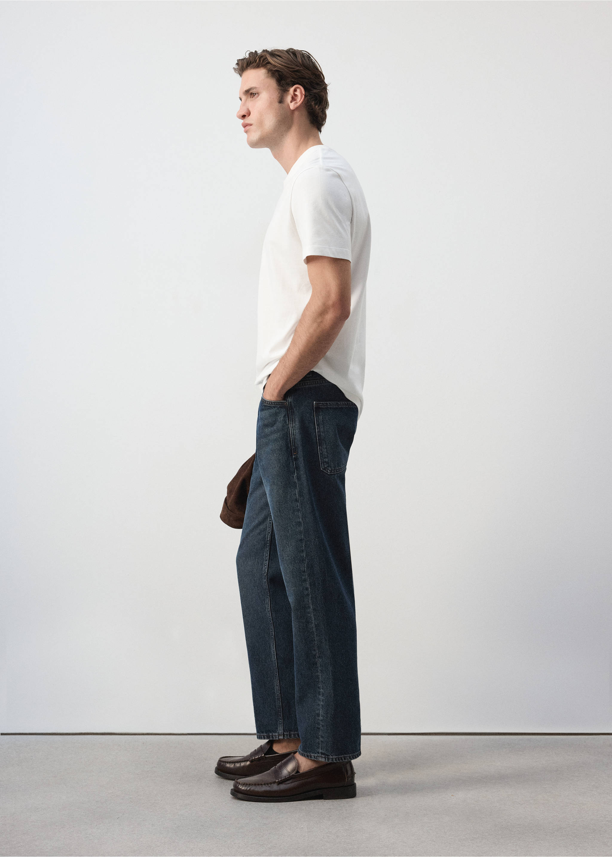 White short-sleeved t-shirt worn with dark blue denim trousers., White. Ref: 47091412-00.