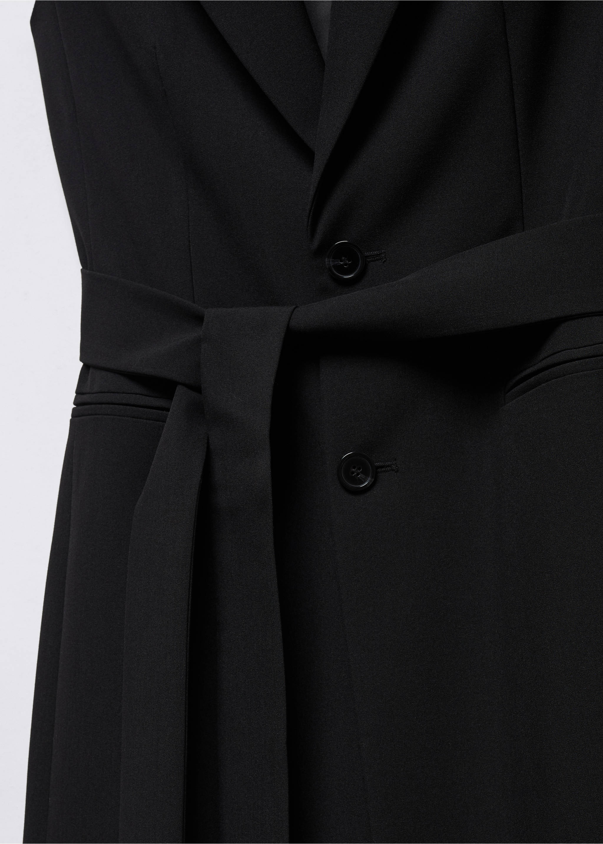 Long gilet with bow - Details of the article 8, Black. Ref: 57040813-00.