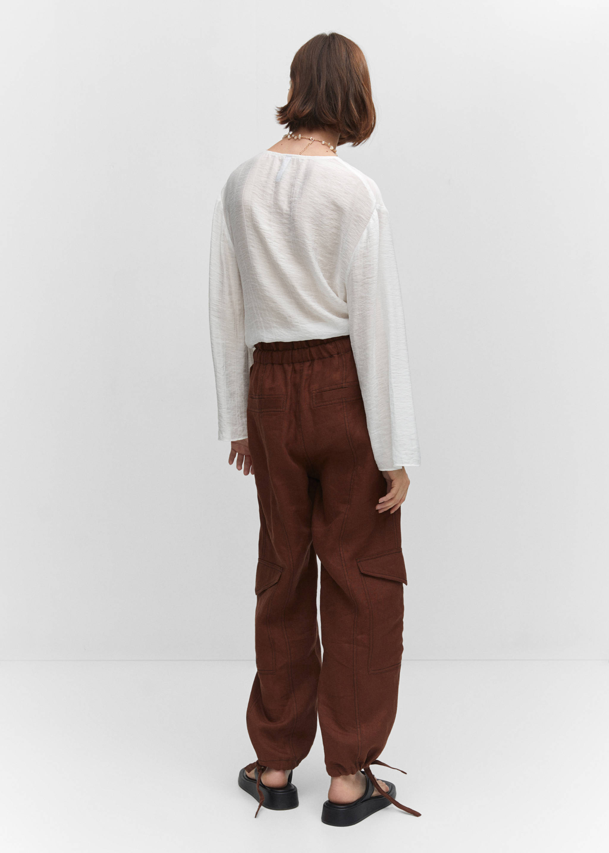 Flared-sleeve blouse with bow - Reverse of the article