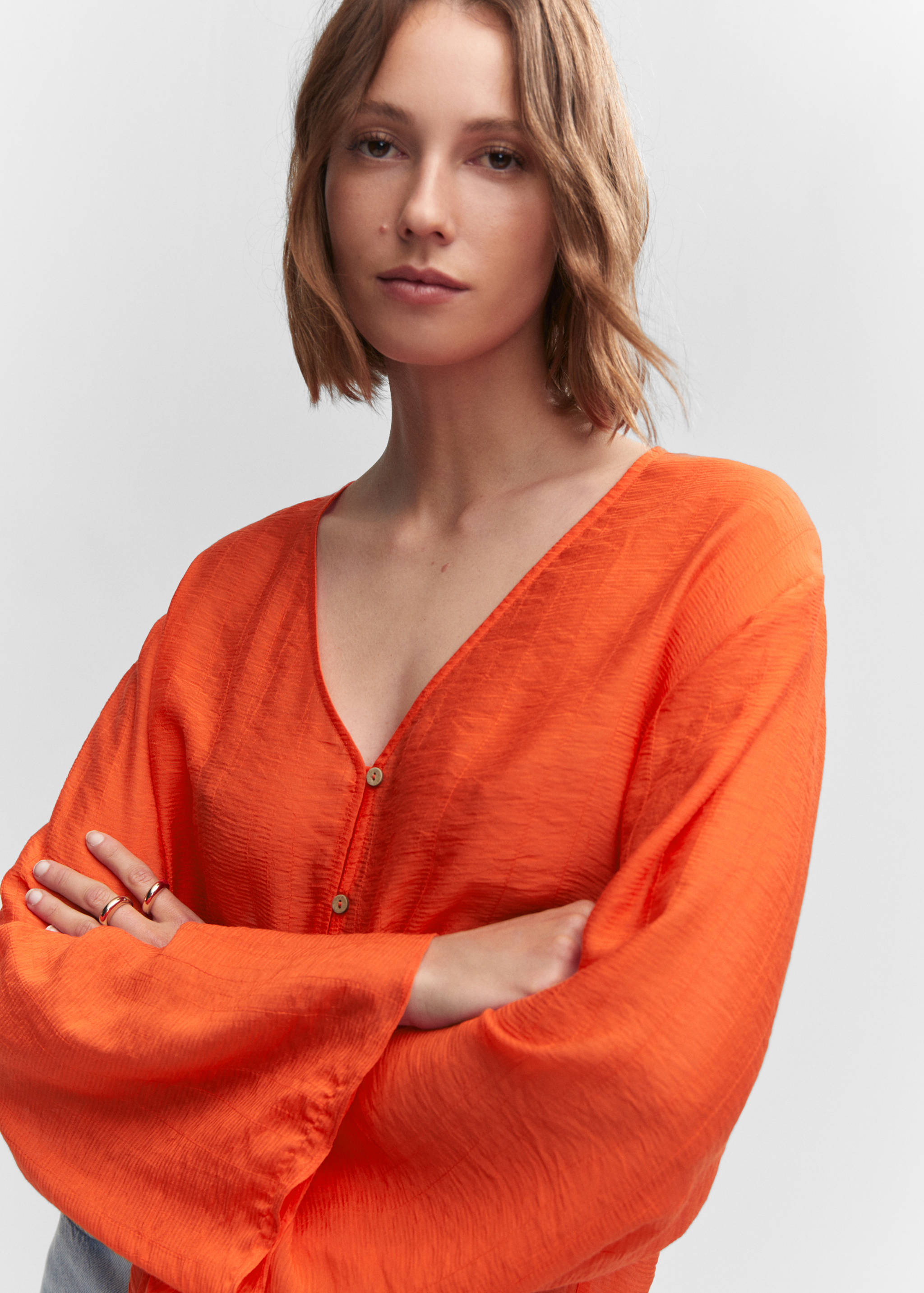 Flared-sleeve blouse with bow - Details of the article 1