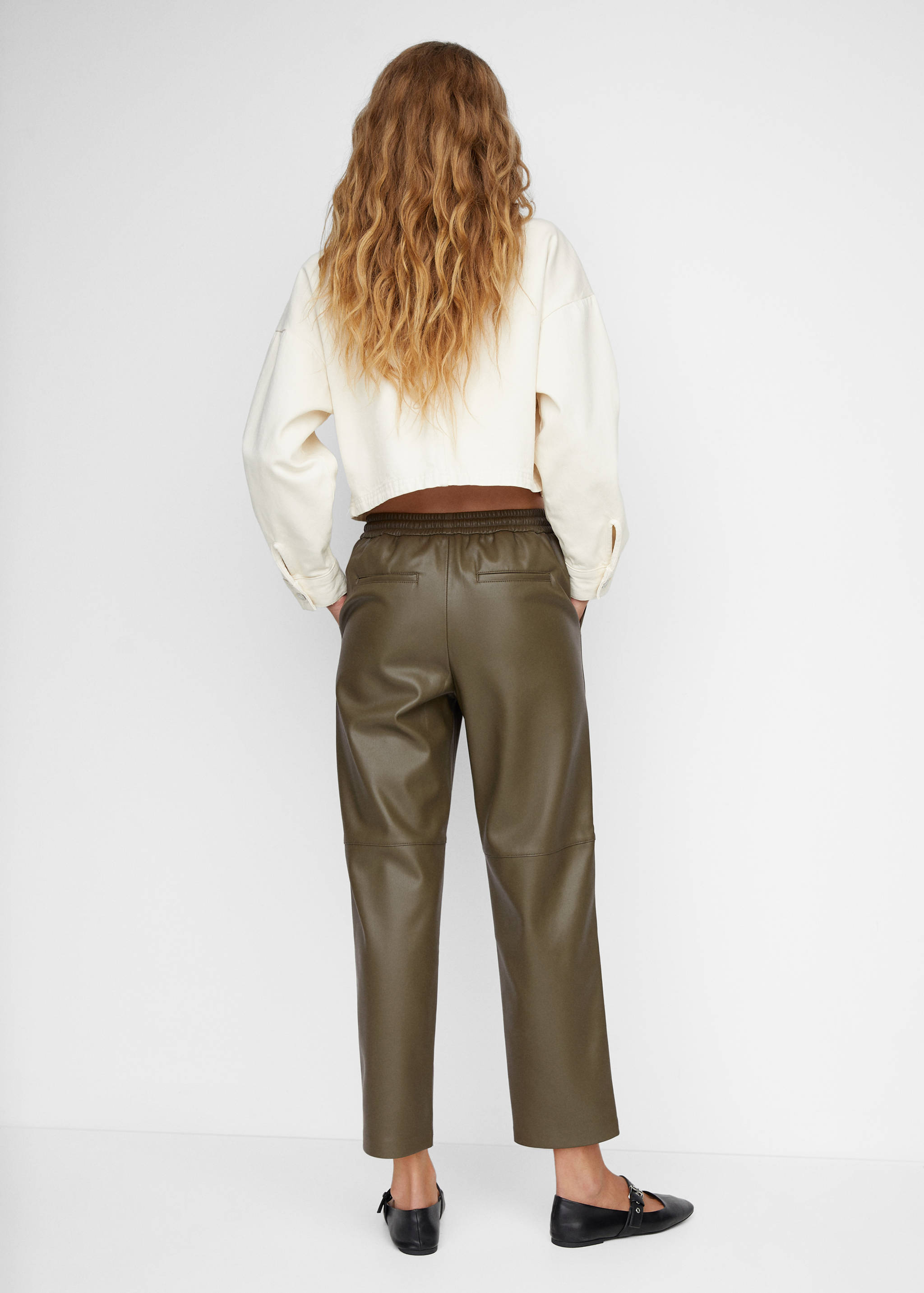 Faux-leather trousers with elastic waist - Reverse of the article