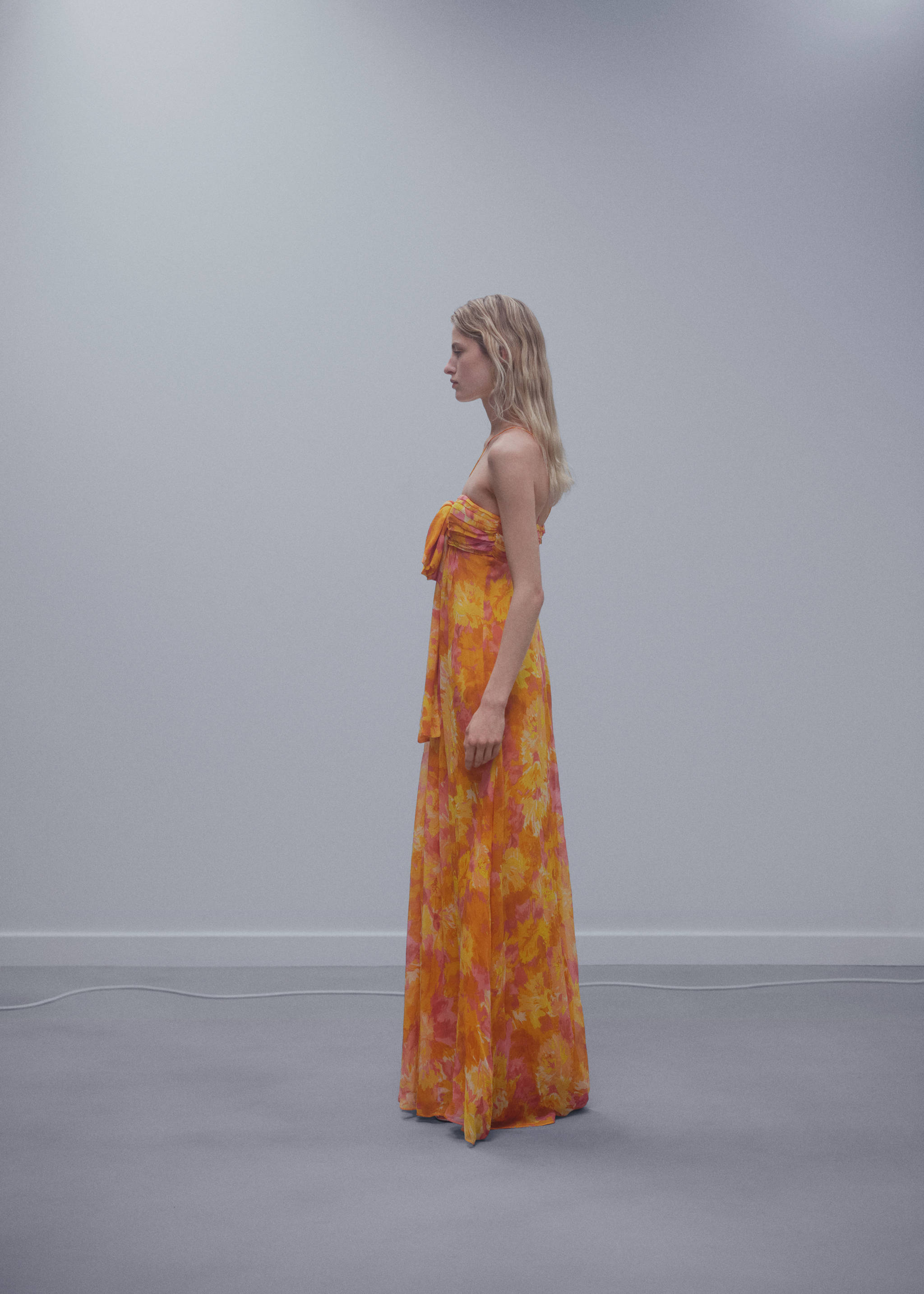 Pleated dress with bow neckline - Details of the article 1, Pastel Orange. Ref: 57071182-00.