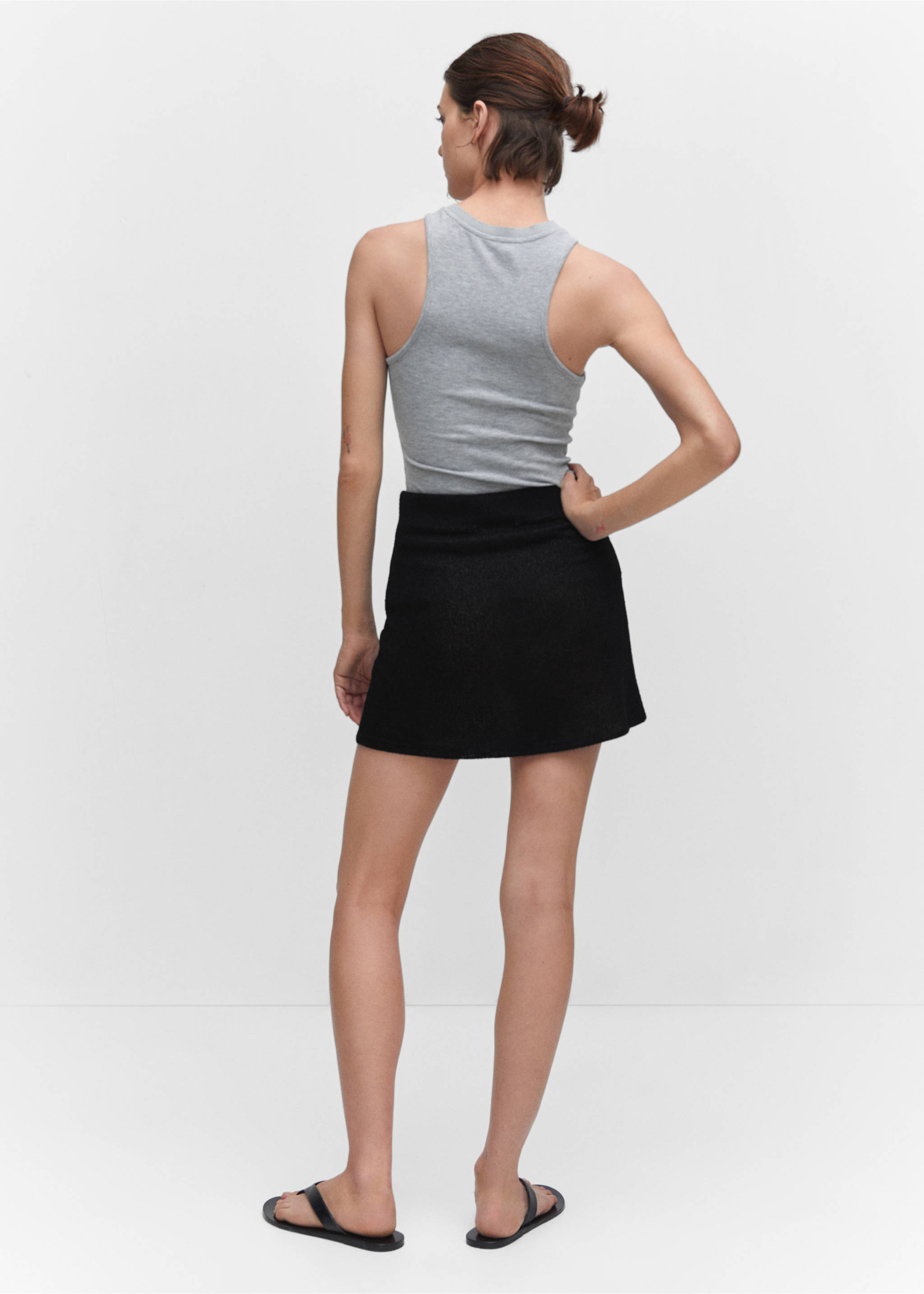 Semi-transparent knitted mini-skirt - Reverse of the article, Black. Ref: 57082887-00.