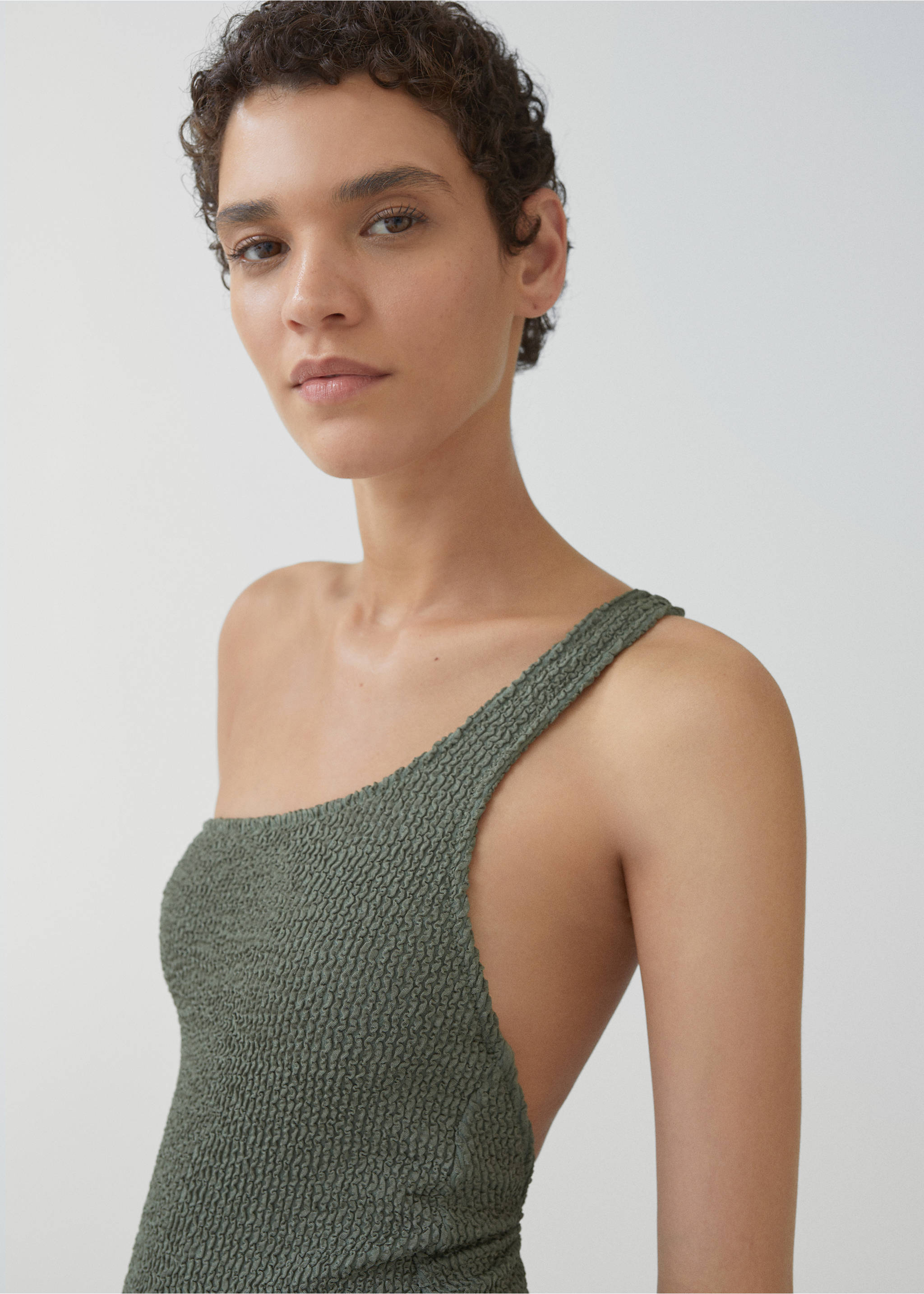 Asymmetrical textured swimsuit - Details of the article 1, Olive Green. Ref: 67014019-00.
