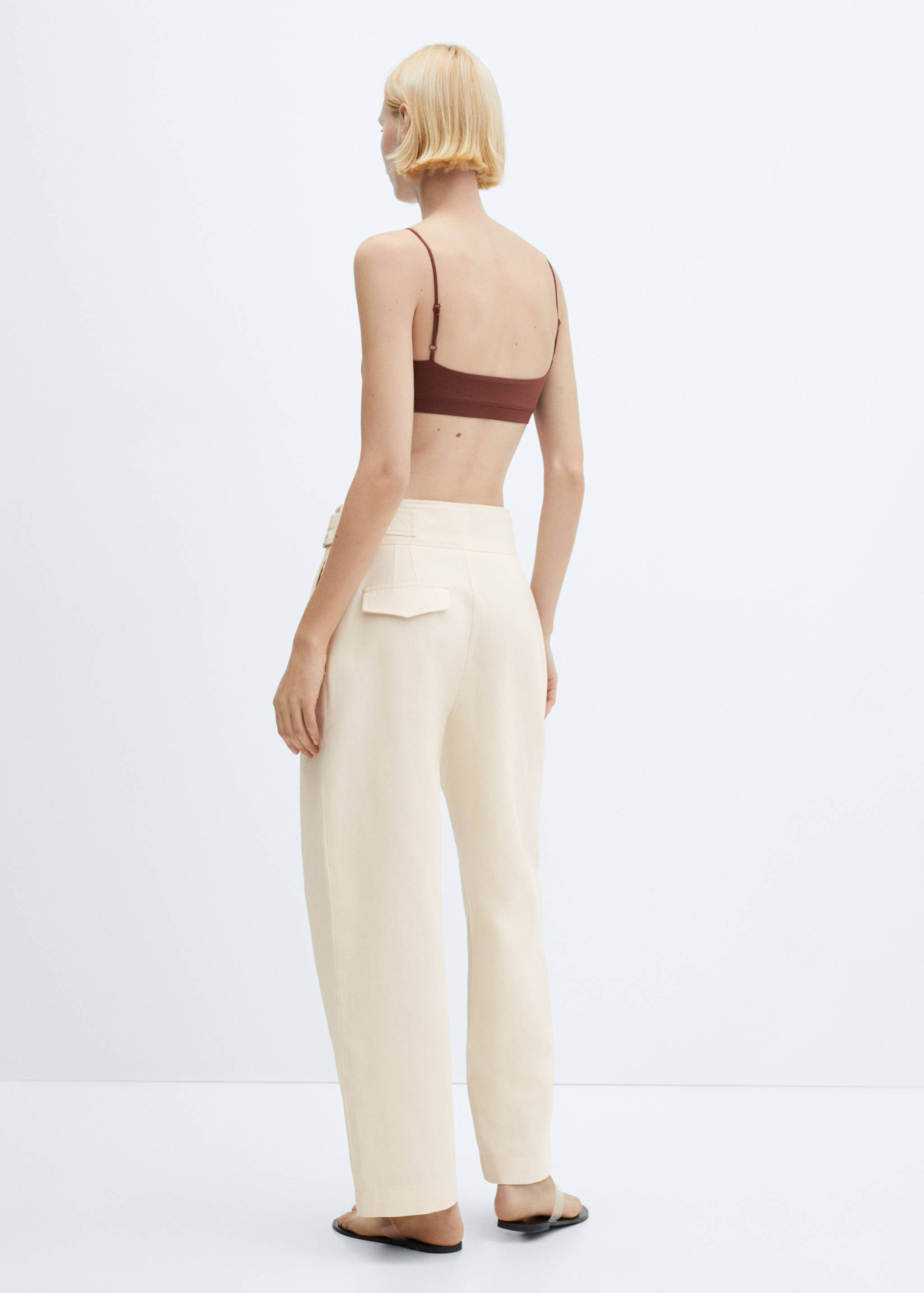 Crossed pleated trousers - Reverse of the article