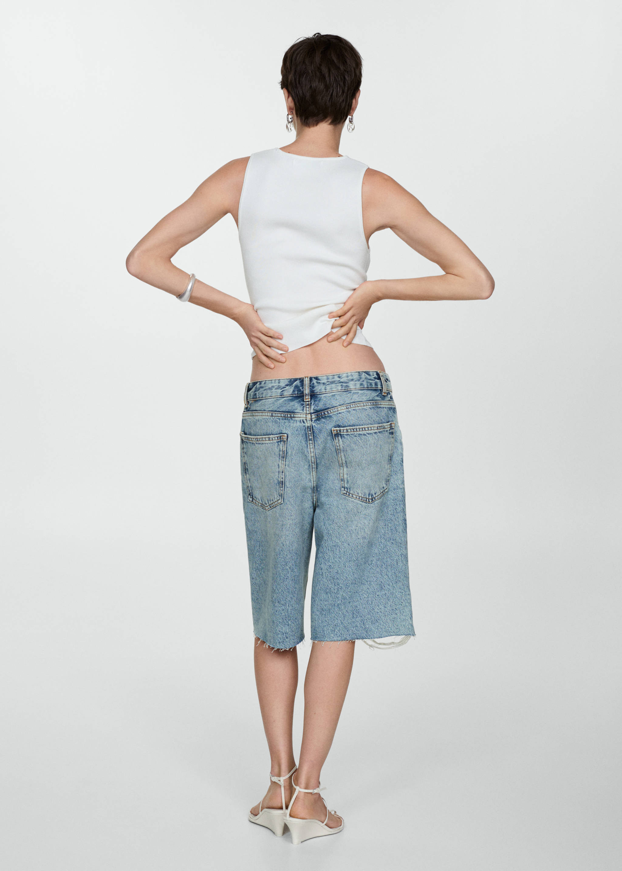 Decorative ripped denim bermuda shorts - Reverse of the article