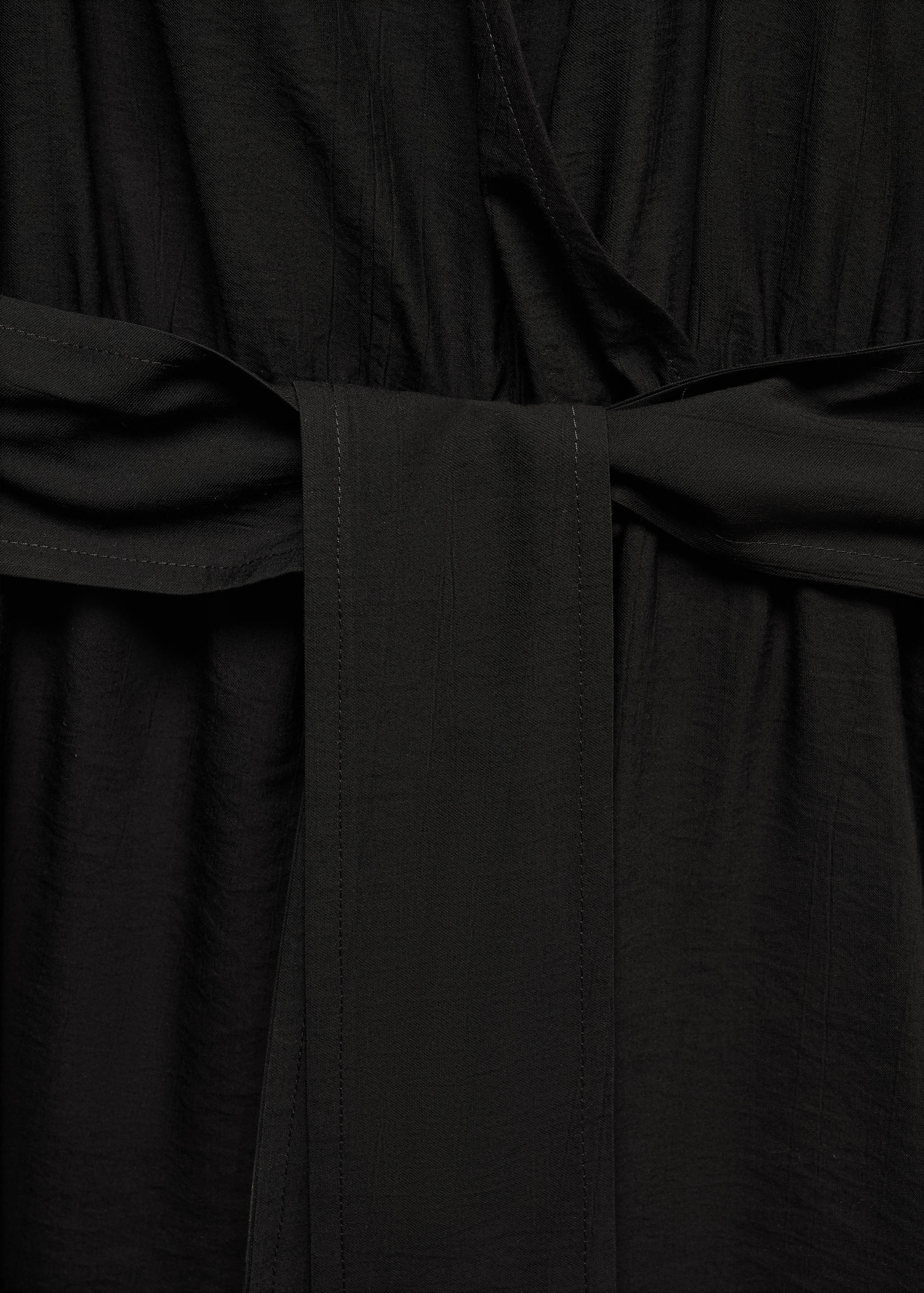 Wikkeljurk met strik - Detail van het artikel 8