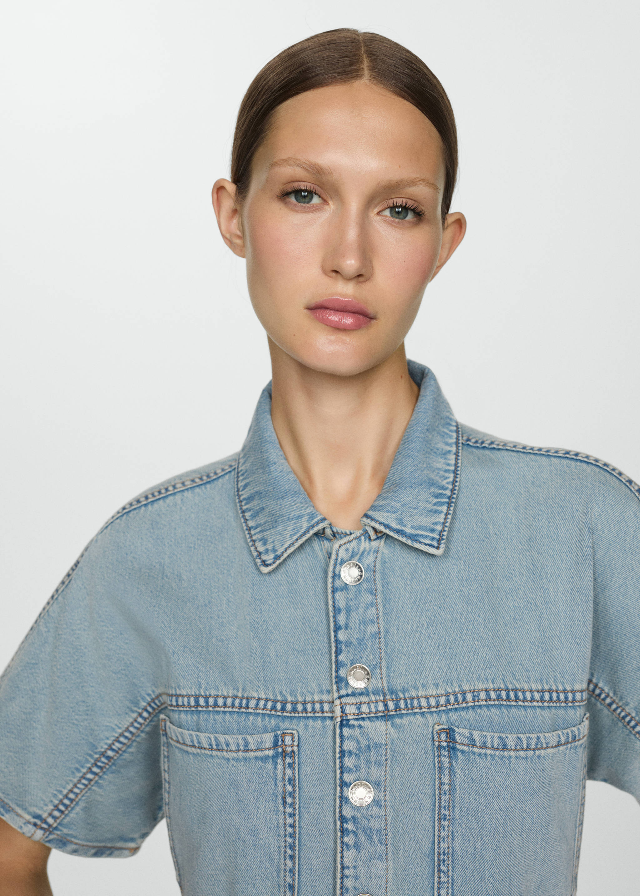 Denim jumpsuit with multi-position buttons - Details of the article 1