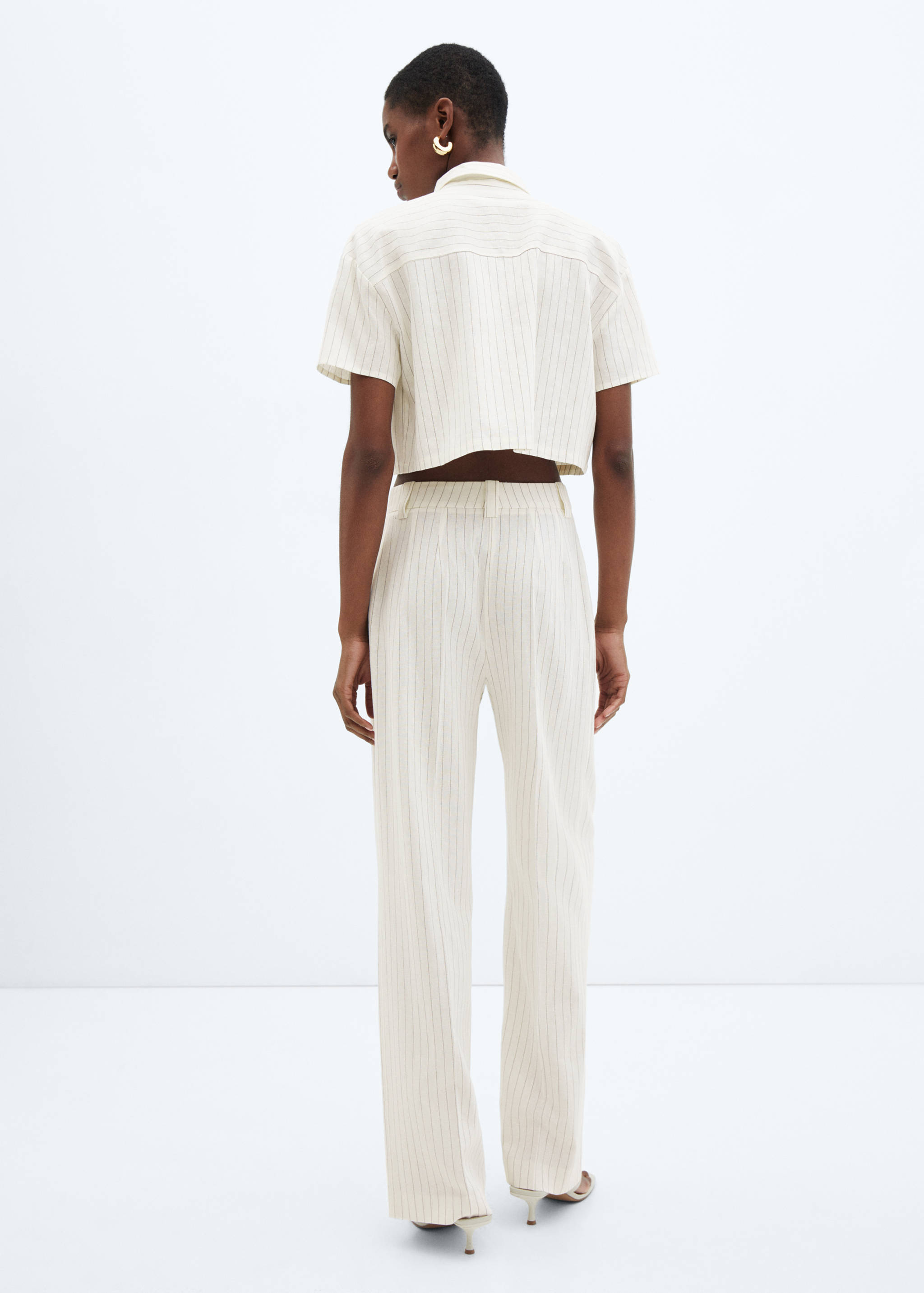 Pleated linen pants - Reverse of the article