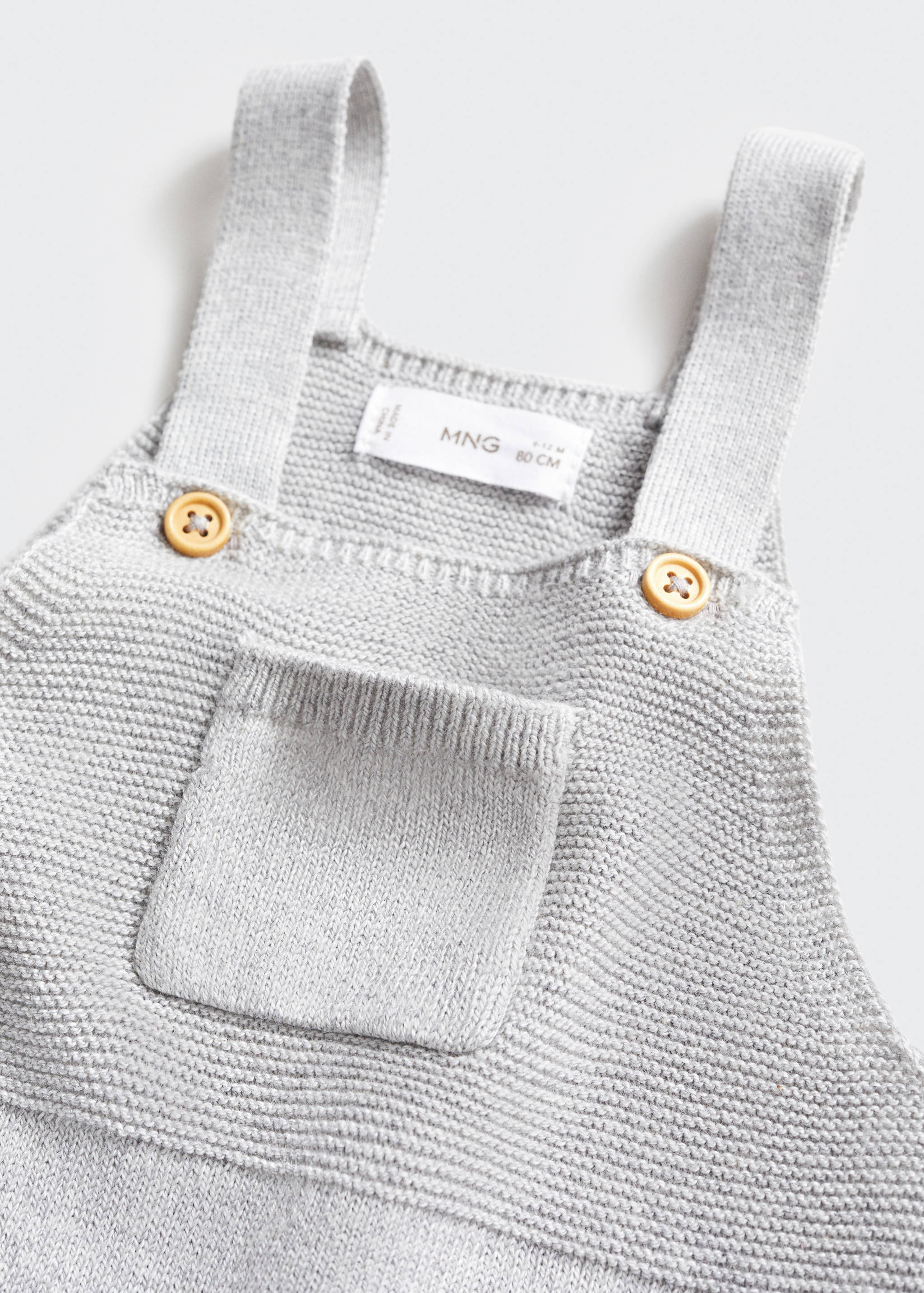 Long knitted dungarees - Details of the article 0
