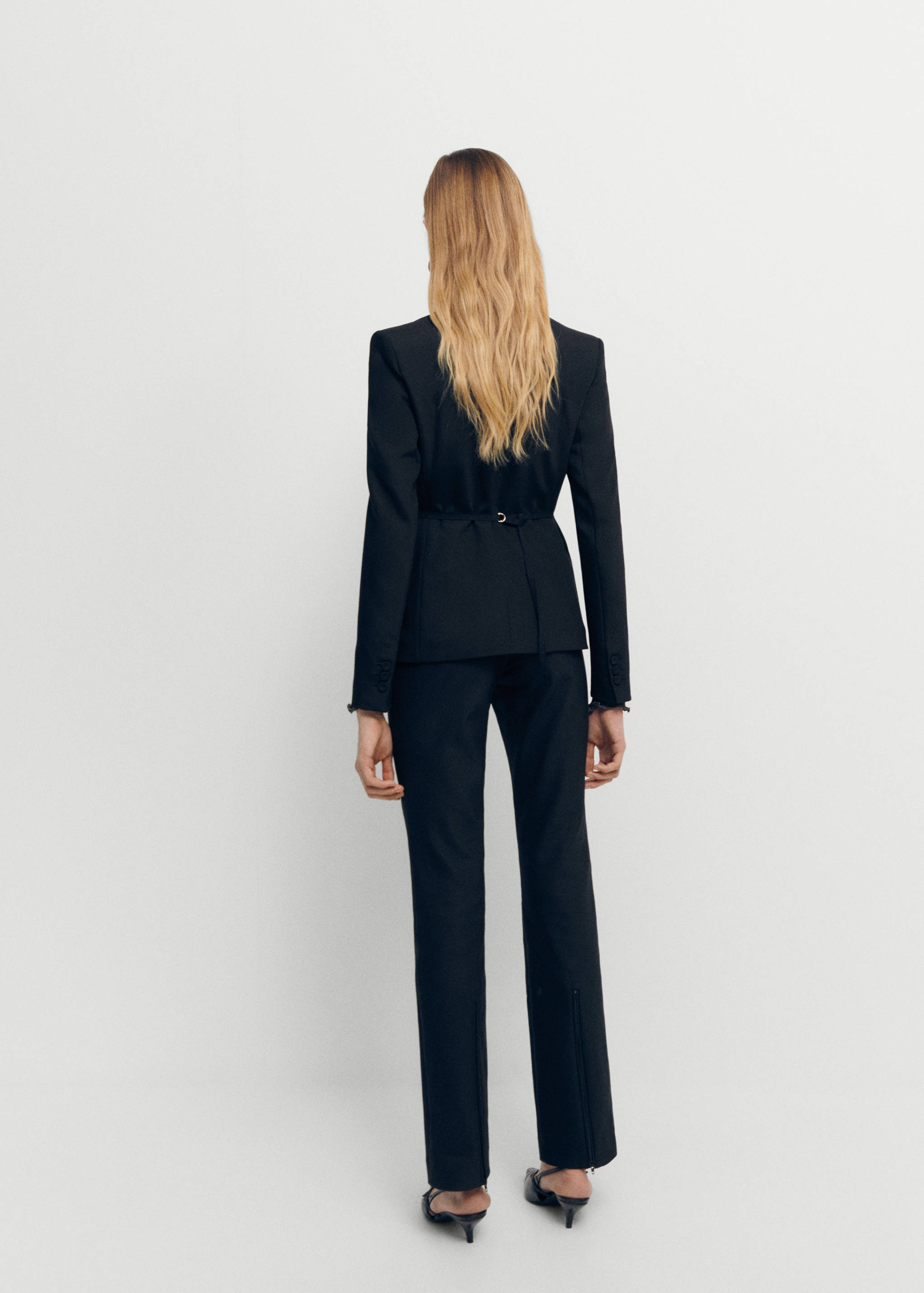 Side slit suit trousers - Reverse of the article