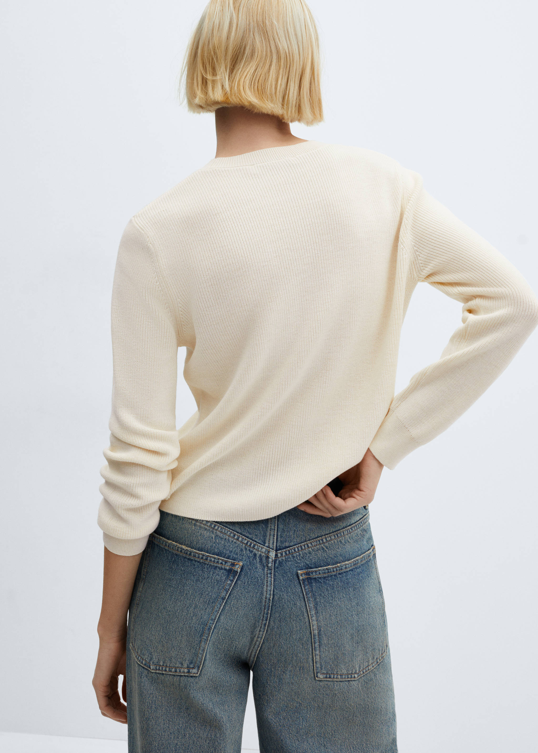 Round-neck knitted sweater - Reverse of the article