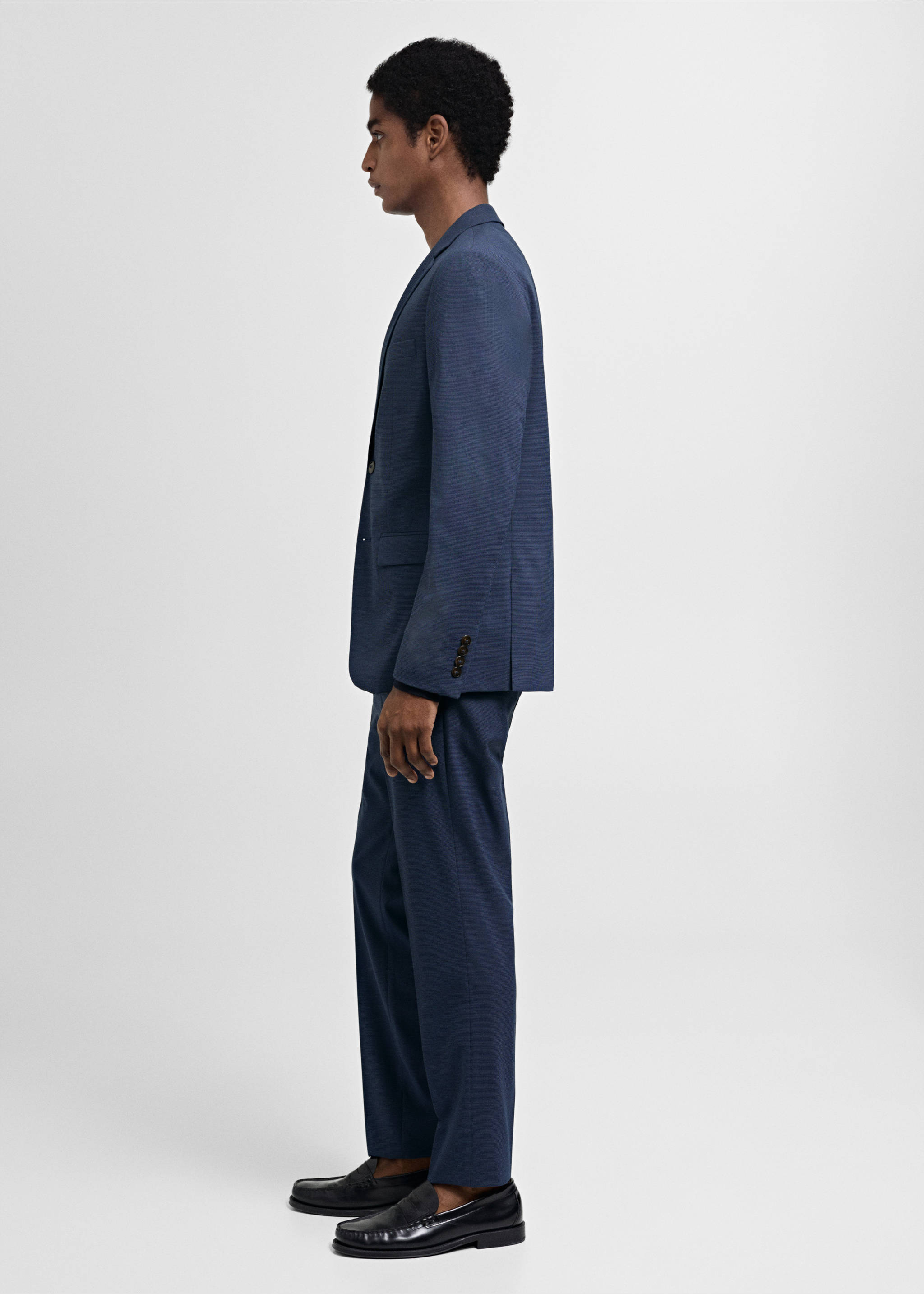 Dark blue trousers with a straight fit, worn with a matching blazer., Ink Blue. Ref: 77000577-02.