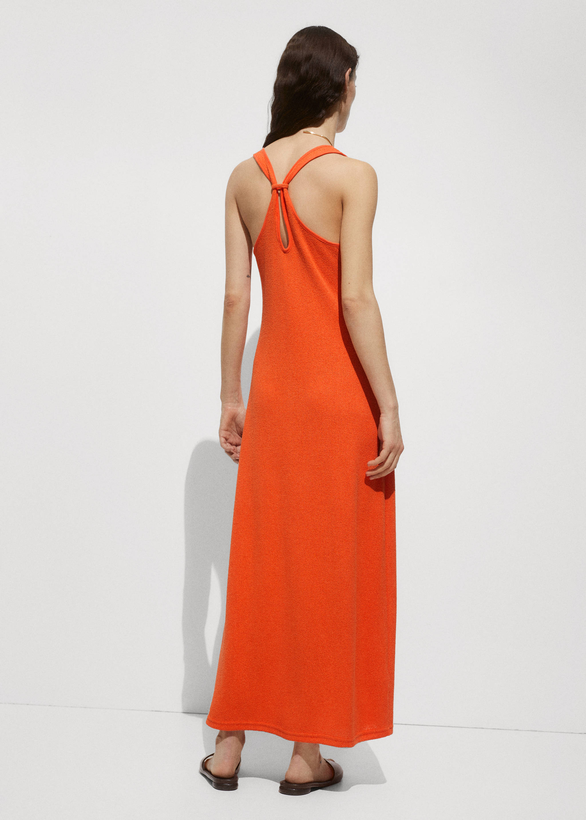 Cross-back knitted dress - Reverse of the article
