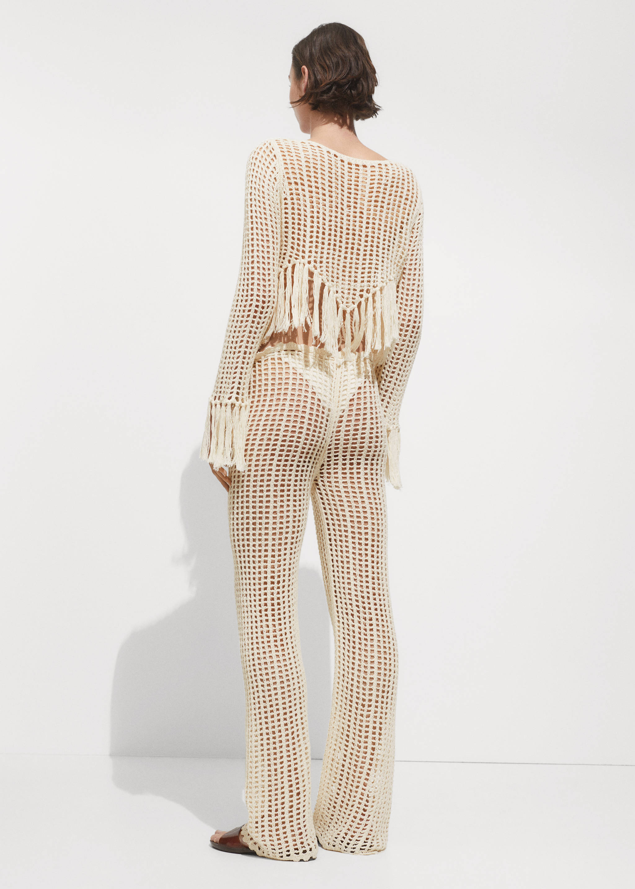 Openwork knitted trousers - Reverse of the article