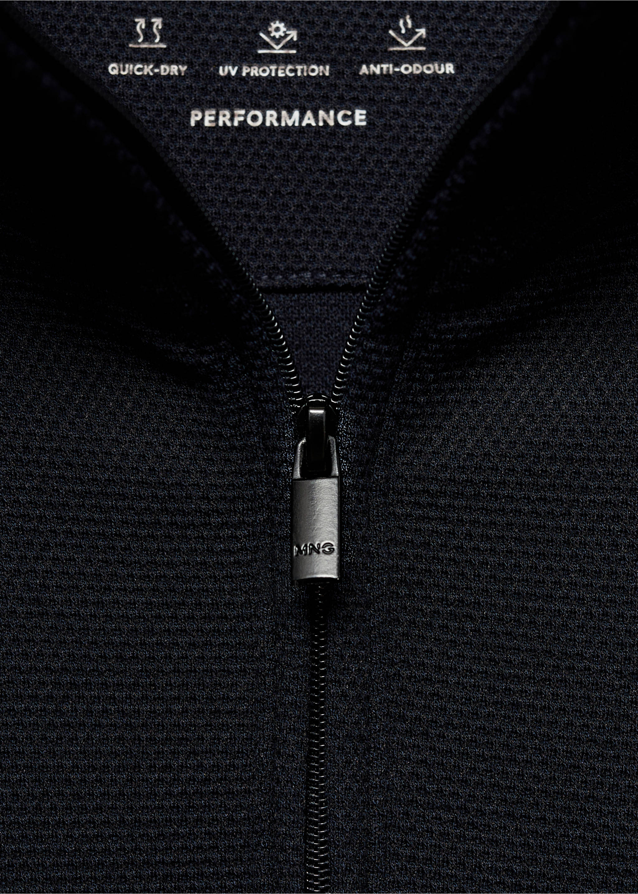 Close-up of a navy performance sweatshirt showing the zip neck detail and feature icons., Dark Navy. Ref: 77025969-00.