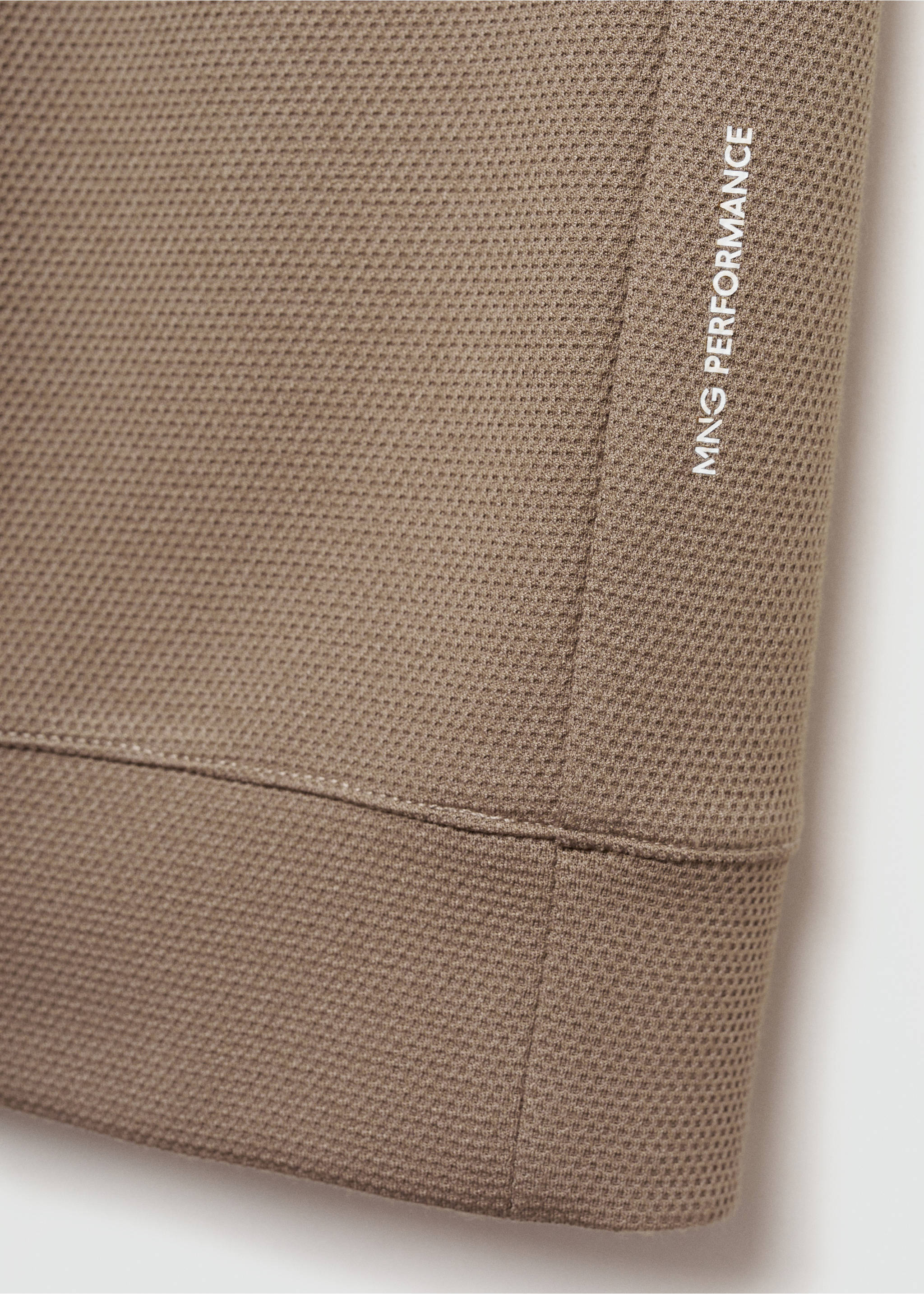 Close-up of brown sweatshirt fabric with texture and MNG PERFORMANCE print., Mink Grey. Ref: 77025969-00.