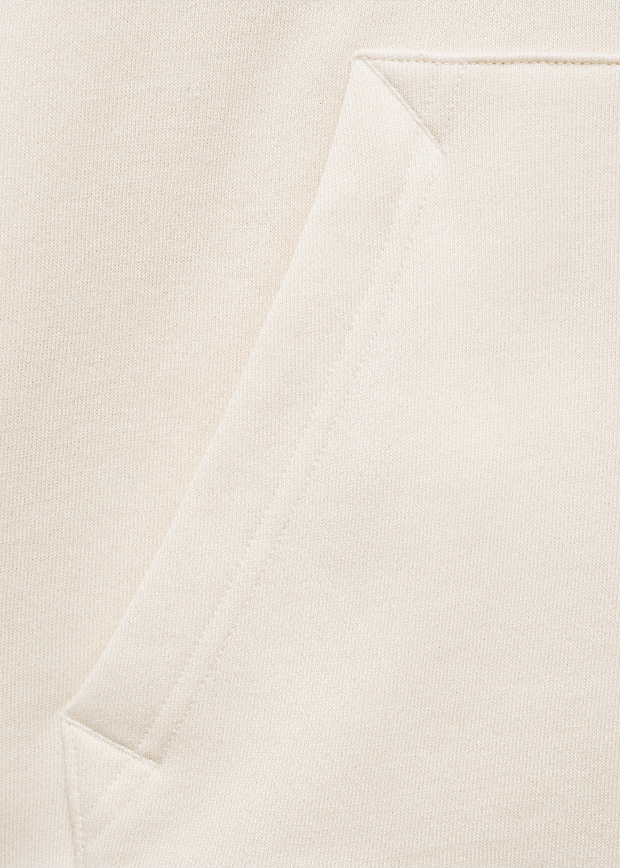 Close-up of the fabric texture and pocket detail on an off-white sweatshirt., Ecru. Ref: 77027115-00.
