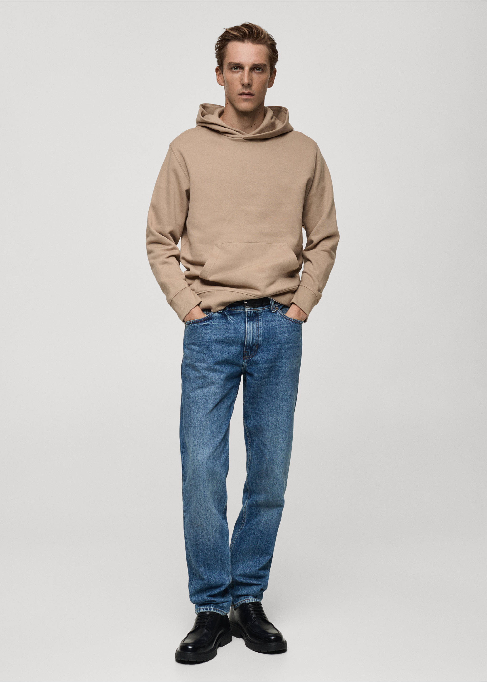 Beige hoodie with a kangaroo pocket, worn with blue denim trousers., Medium Brown. Ref: 77027115-00.