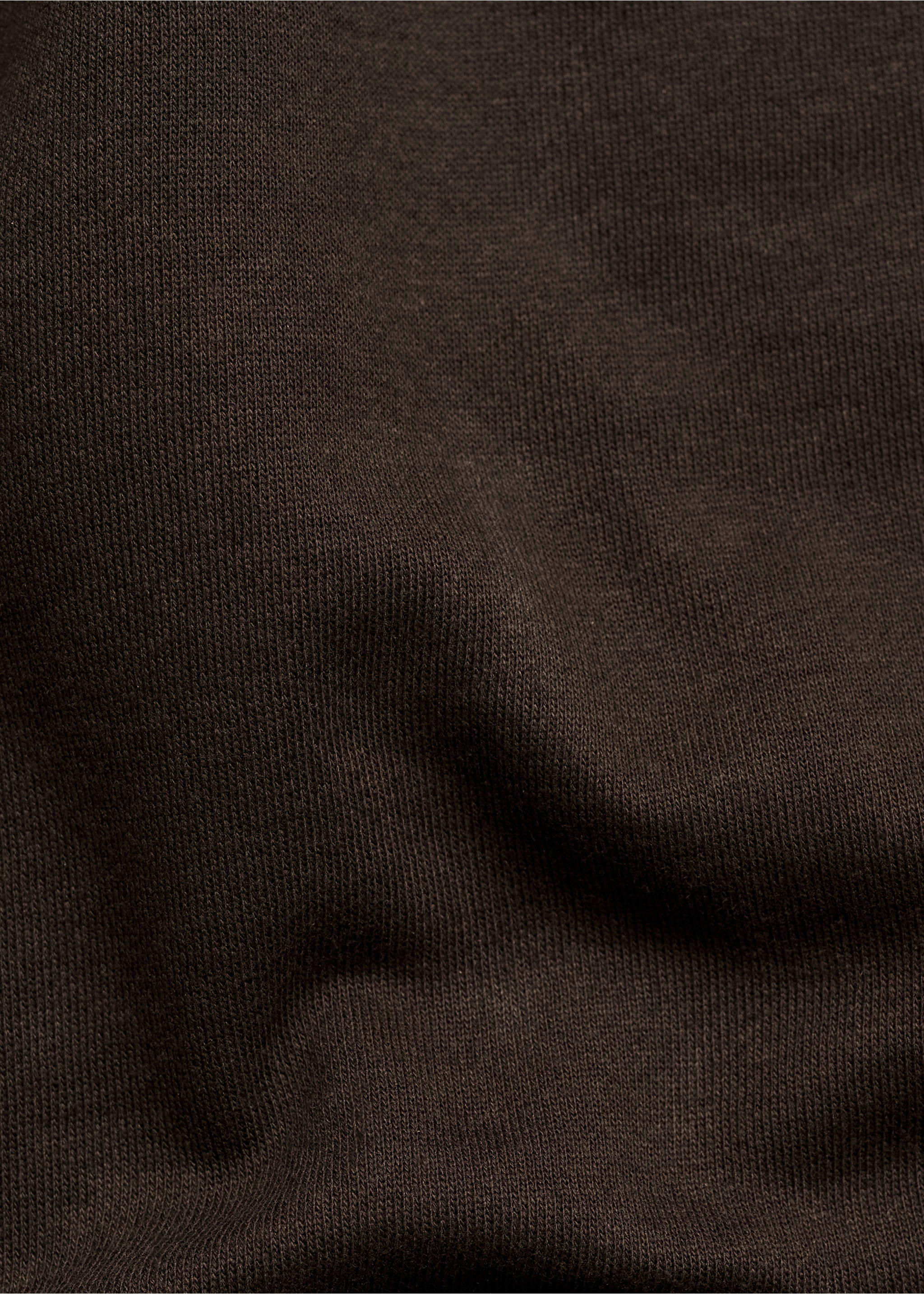 Close-up of the dark brown sweatshirt fabric texture., Chocolate. Ref: 77027115-00.