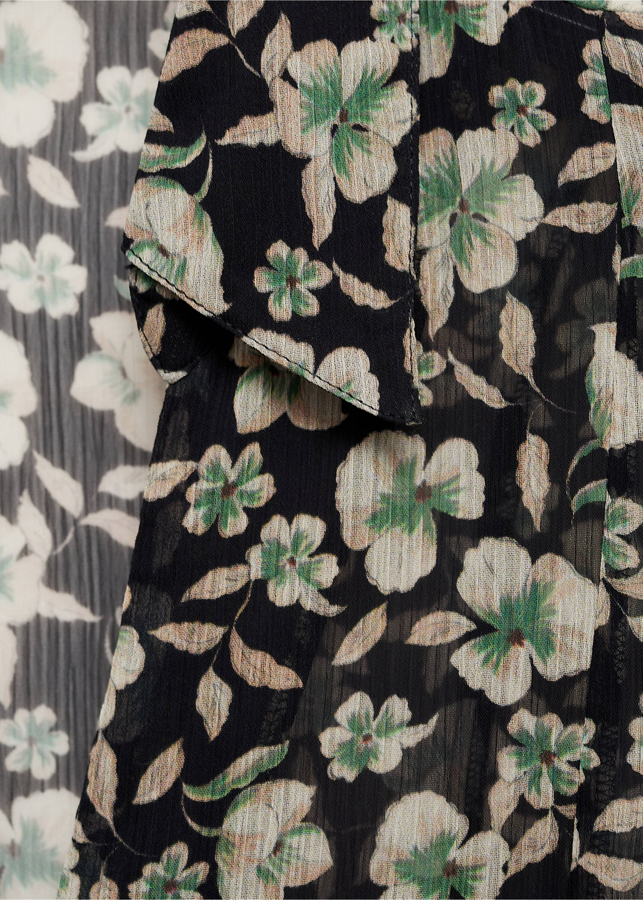Close-up of the black floral print sheer pleated shirt fabric., Black. Ref: 77027722-00.