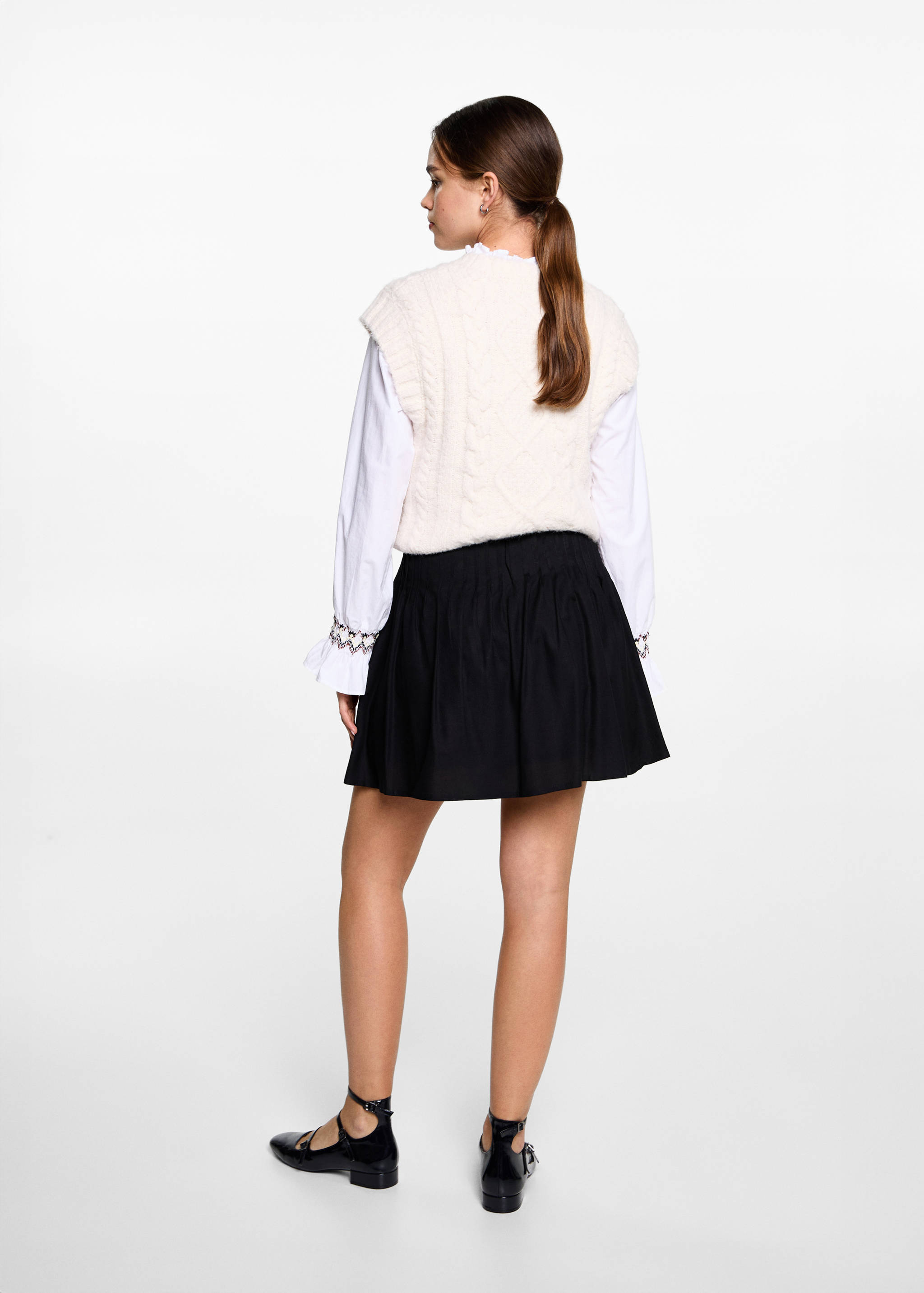 Jupe décorée de clous - Verso de l’article