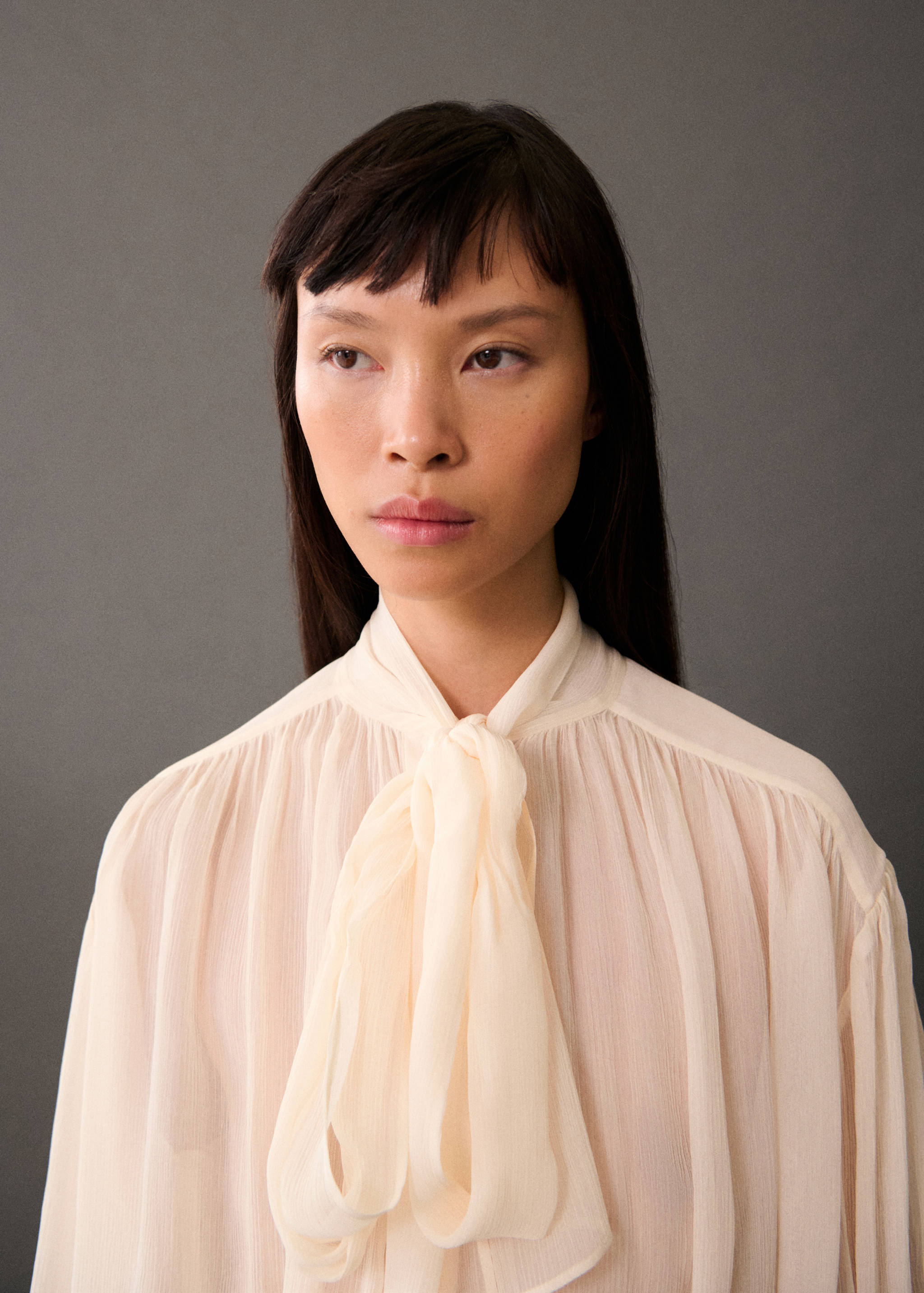 Blouse with puffed sleeves and bow - Details of the article 1