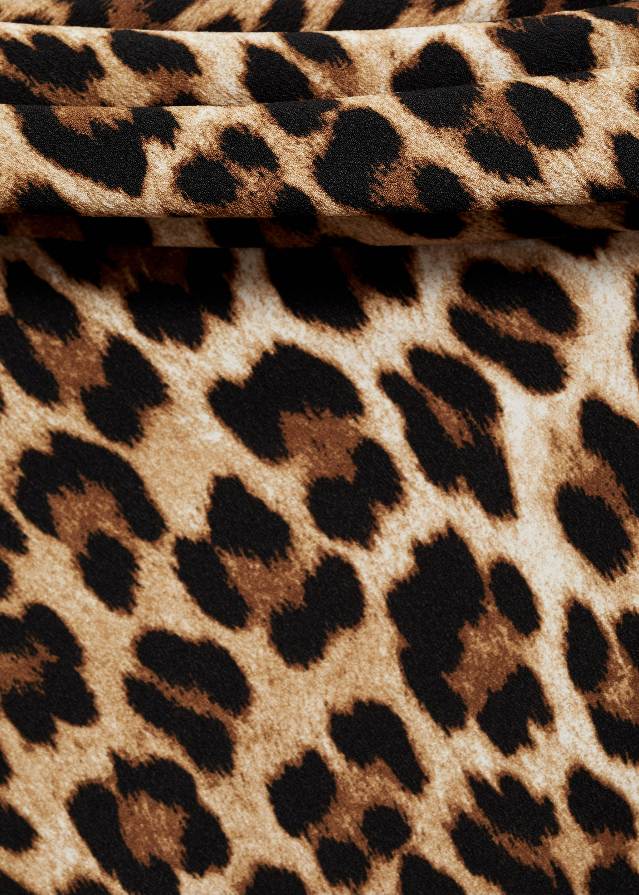 Close-up of a leopard print dress fabric detailing the pattern., Brown. Ref: 77035673-00.