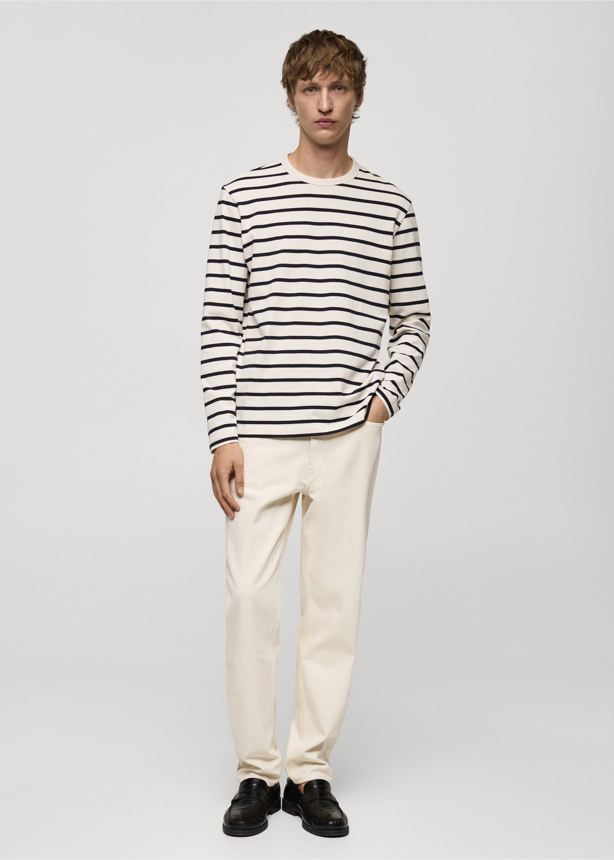 Striped long-sleeve t-shirt in cream and black, worn with trousers., Ecru. Ref: 77035975-00.