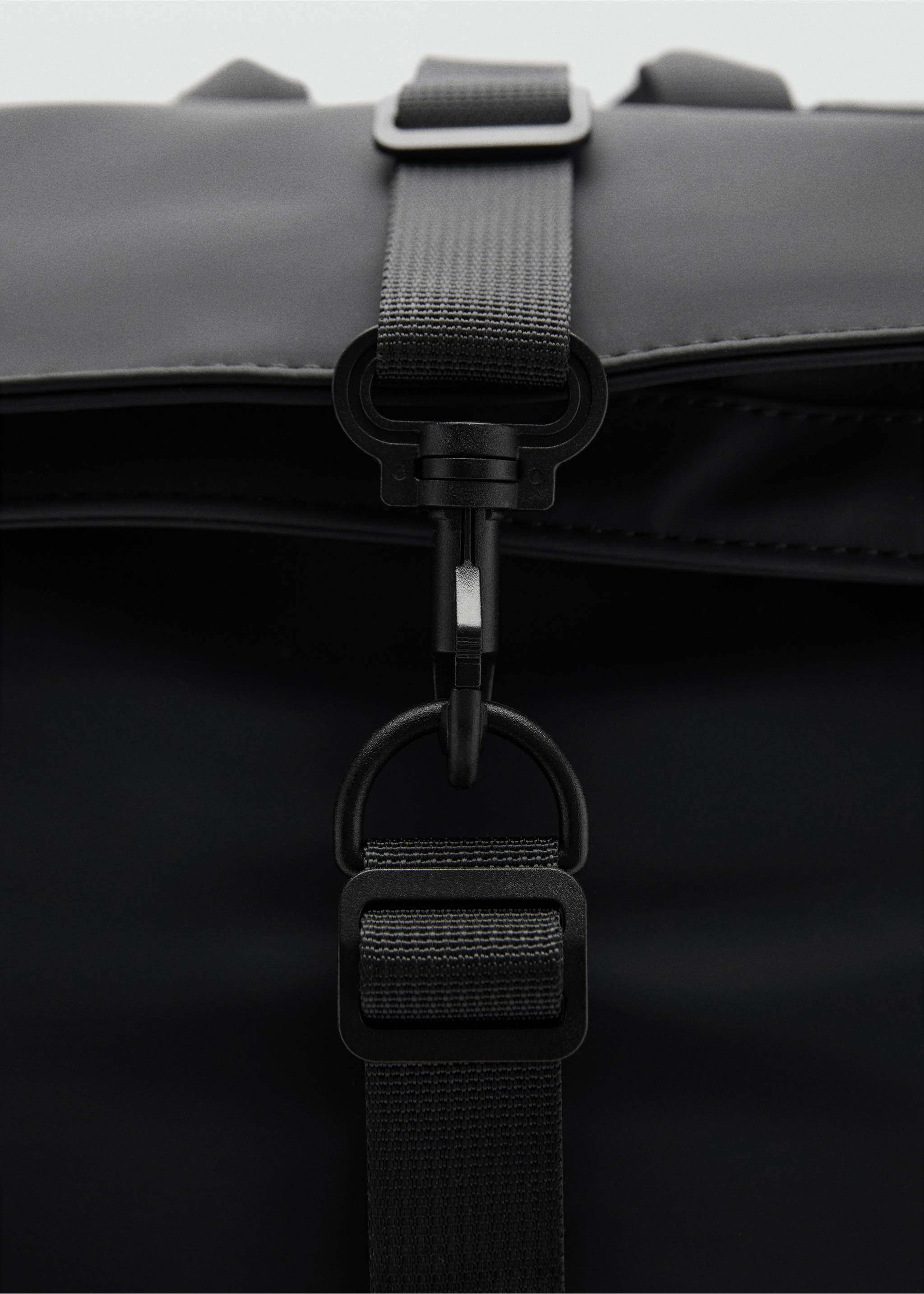 Rubberized backpack with flap closure - Details of the article 1, Black. Ref: 77044451-00.