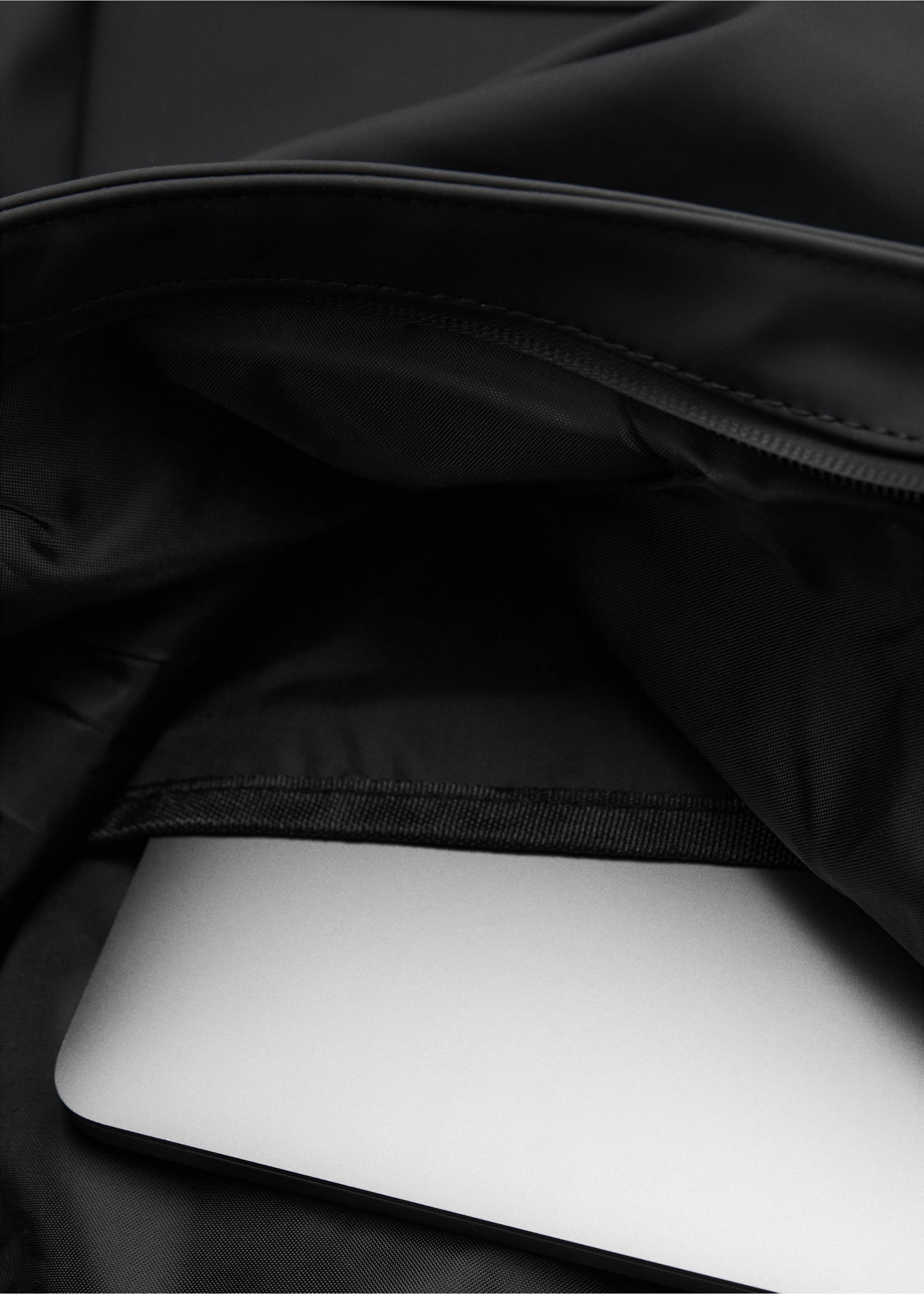 Rubberized backpack with flap closure - Details of the article 2, Black. Ref: 77044451-00.
