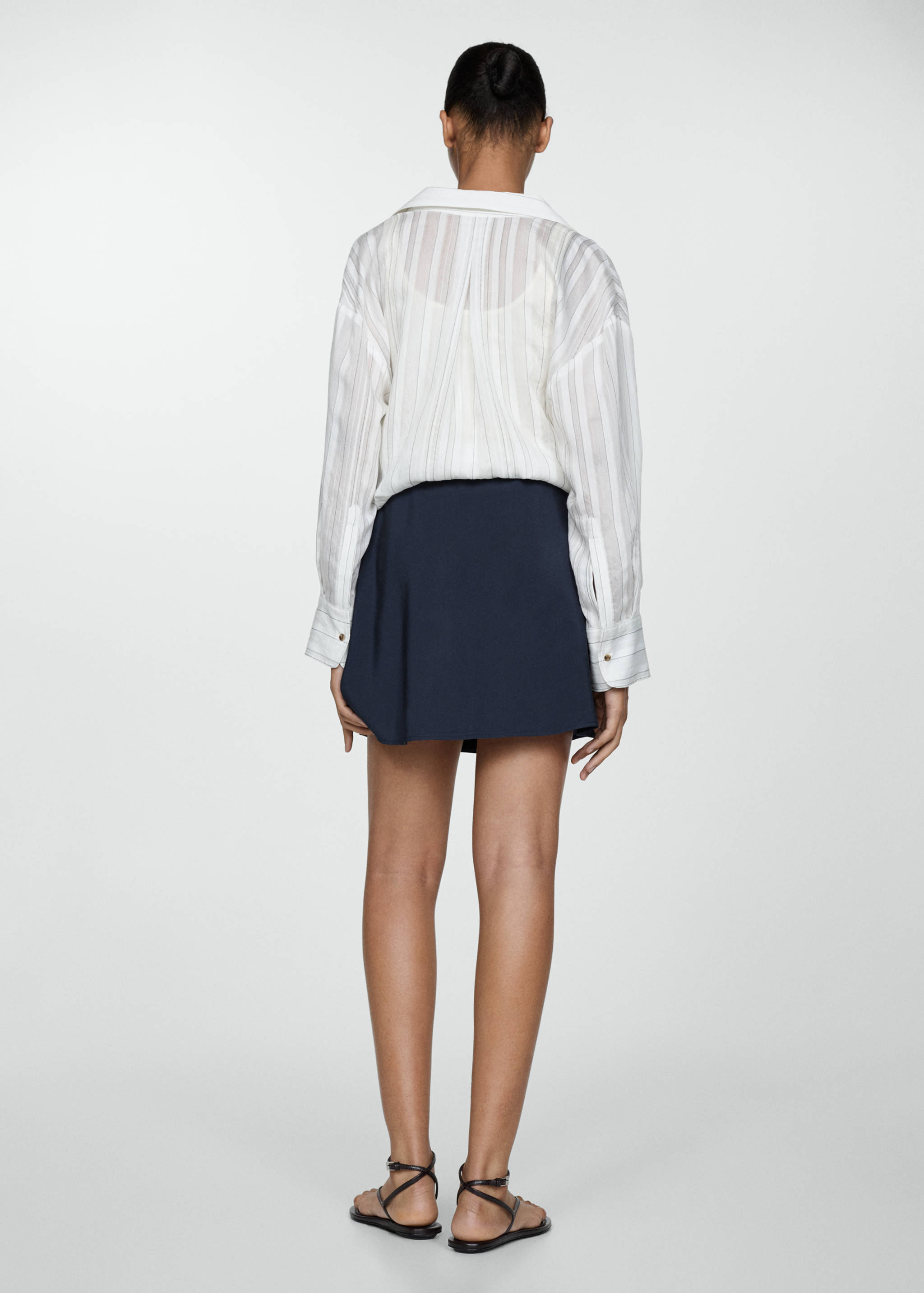 Mini-skirt with decorative buttons - Reverse of the article