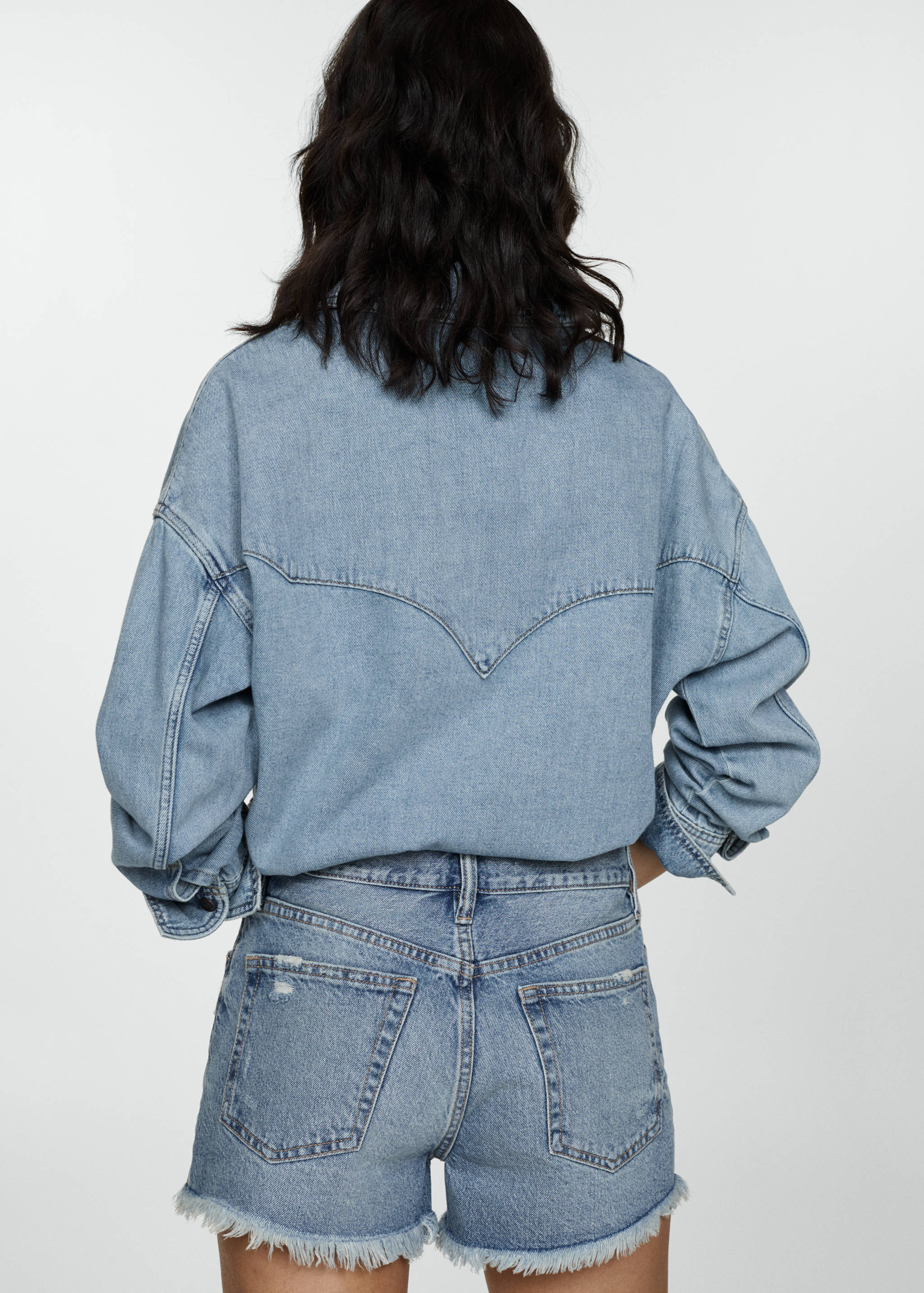 Denim shorts with frayed hem - Reverse of the article